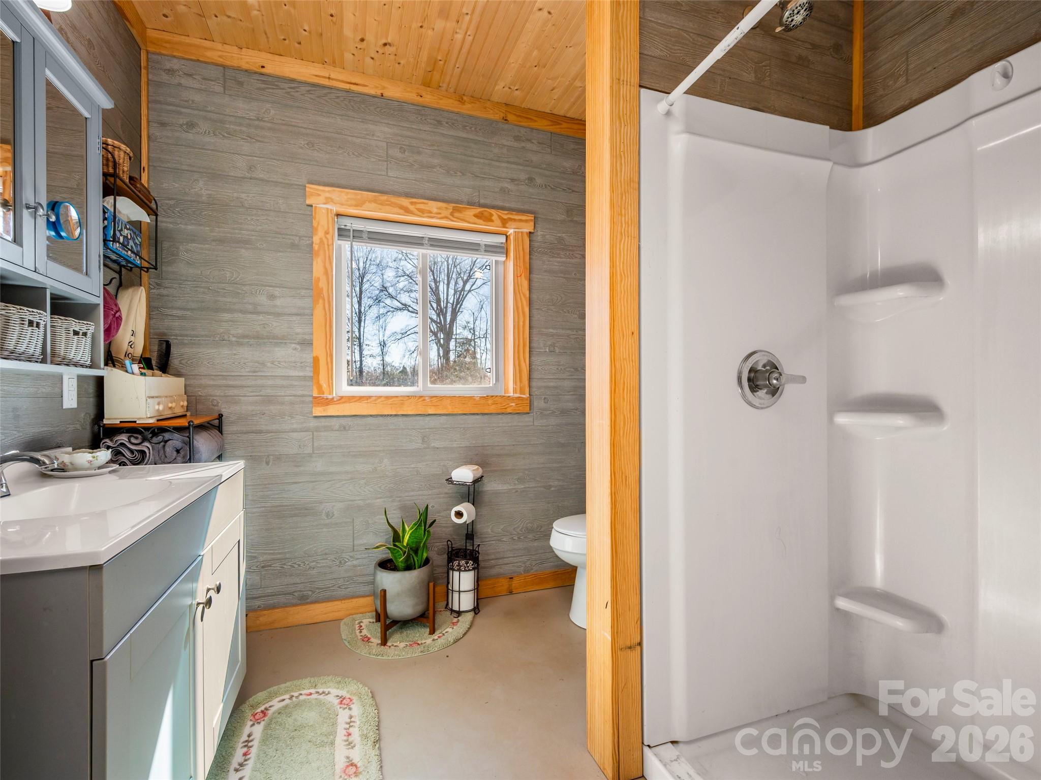 873 Ellenboro Henrietta Road Ellenboro, NC 28040 - Photo 18 of 48 a bathroom with a sink mirror toilet and shower