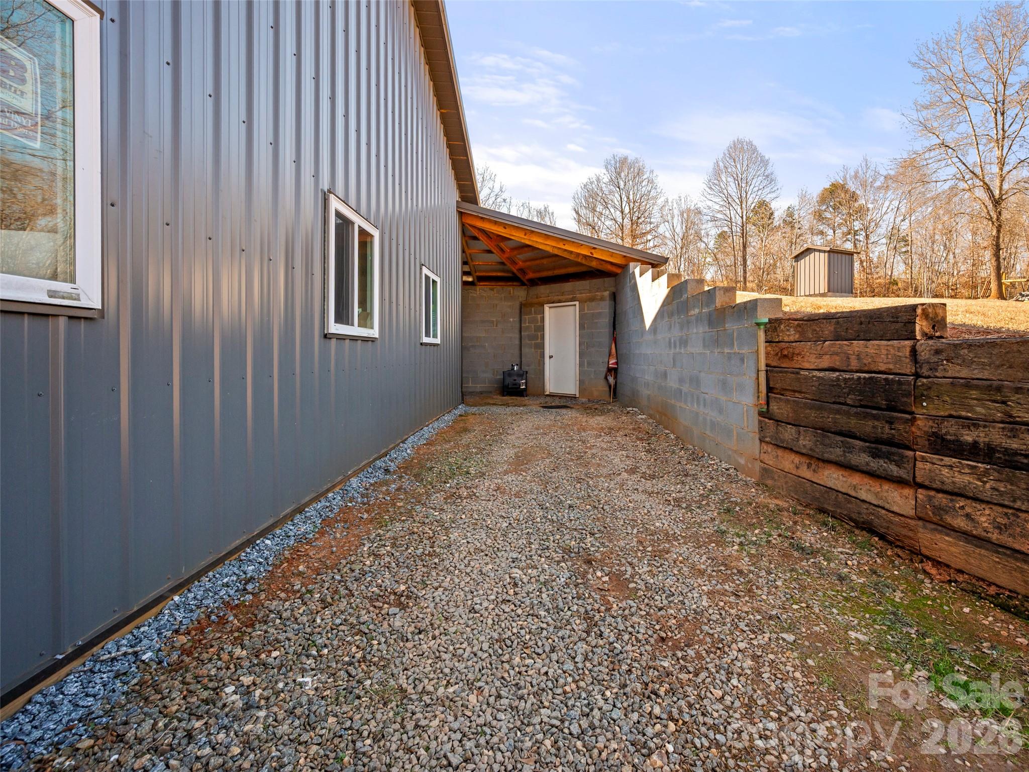 873 Ellenboro Henrietta Road Ellenboro, NC 28040 - Photo 21 of 48 a backyard of a house with lots of green space