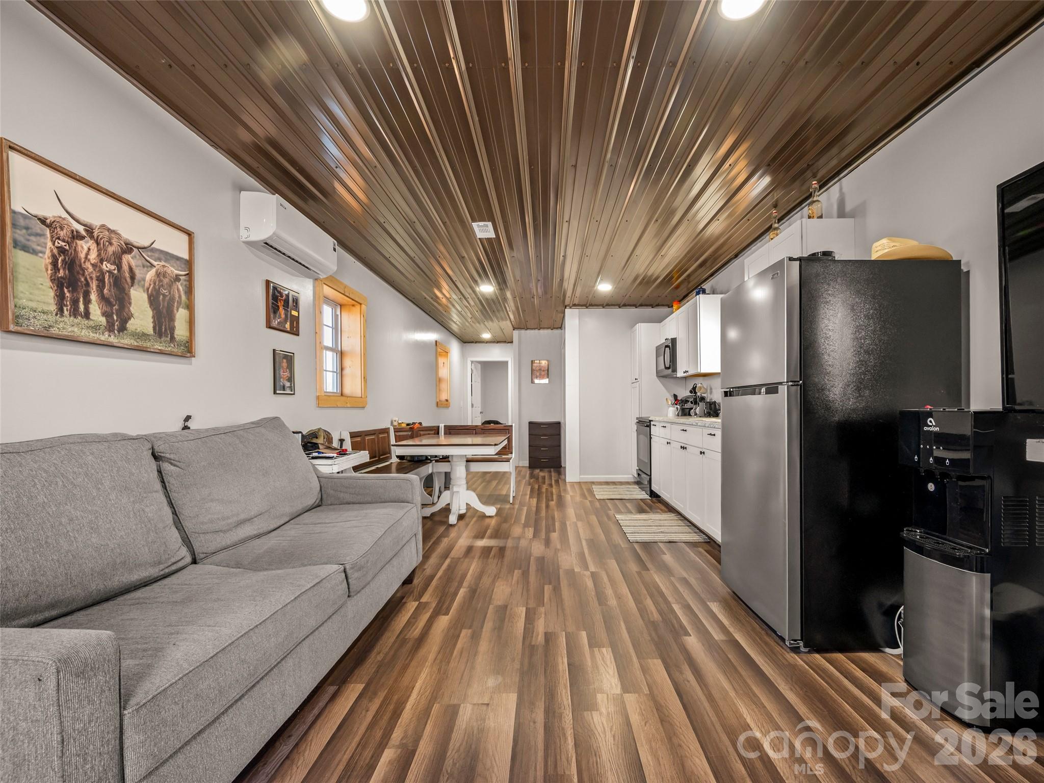873 Ellenboro Henrietta Road Ellenboro, NC 28040 - Photo 36 of 48 a living room with furniture and a kitchen view