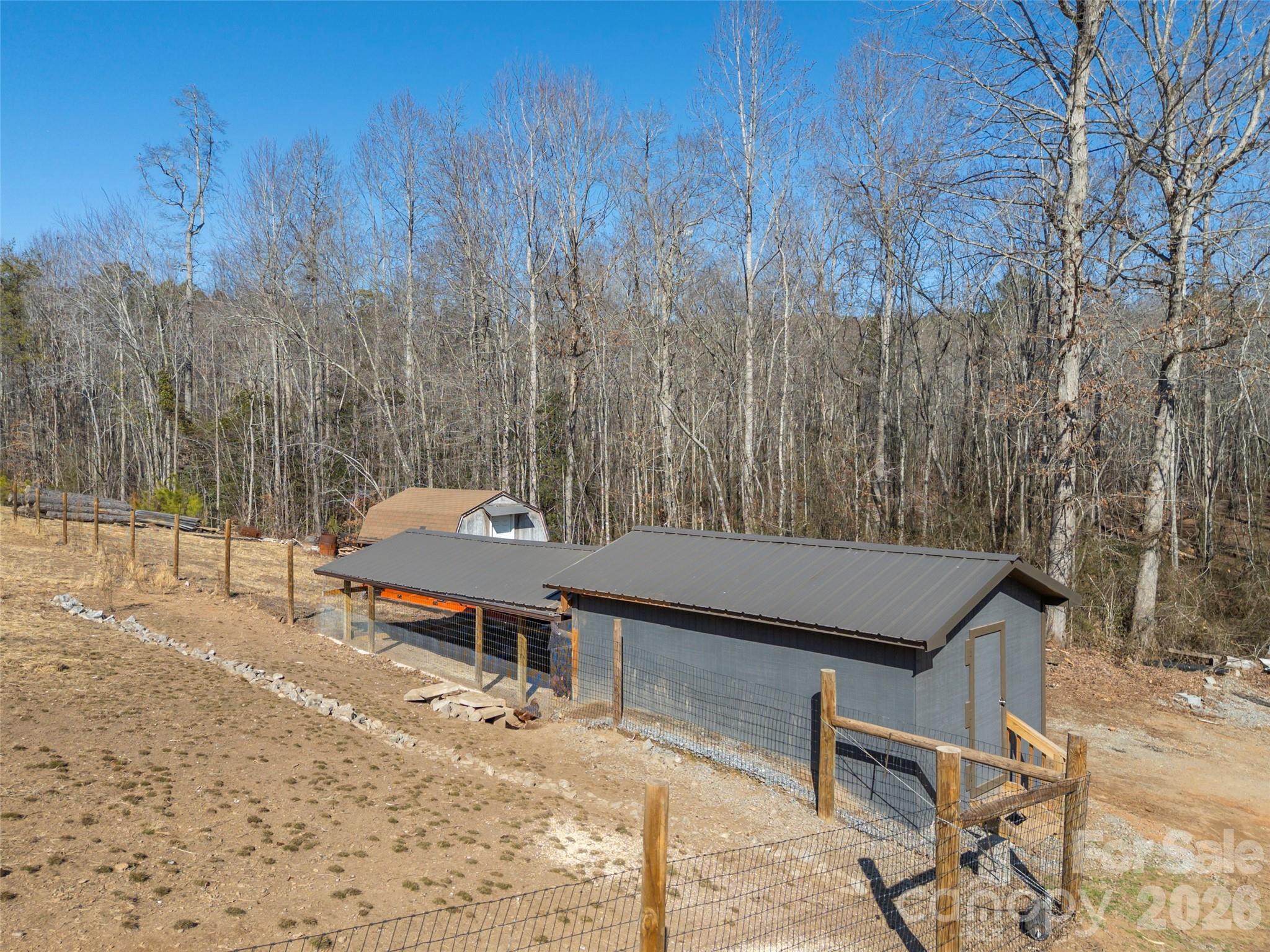 873 Ellenboro Henrietta Road Ellenboro, NC 28040 - Photo 46 of 48 a backyard of a house with table and chairs