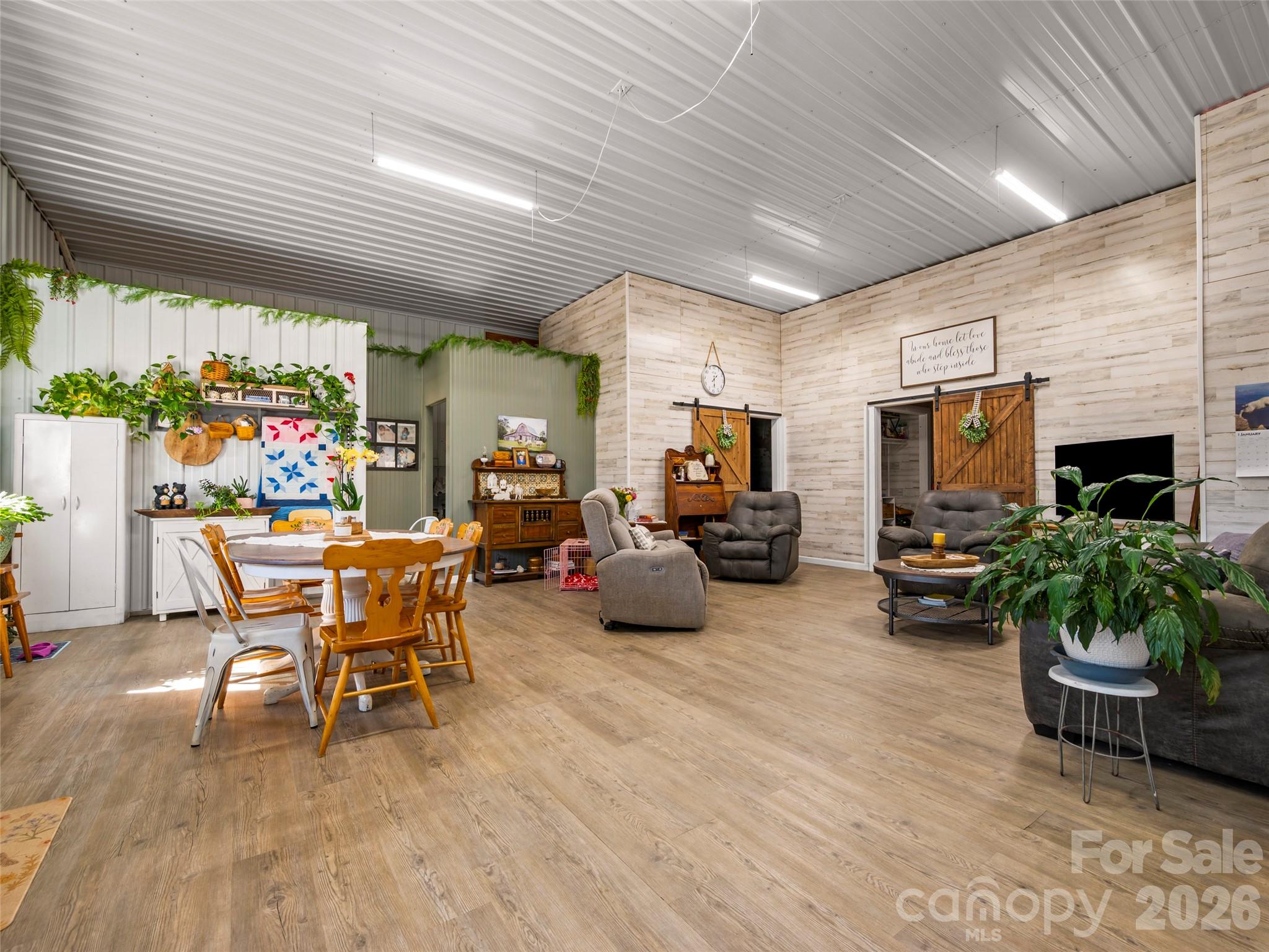 873 Ellenboro Henrietta Road Ellenboro, NC 28040 - Photo 7 of 48 a outdoor space with furniture a flat screen tv and a fireplace