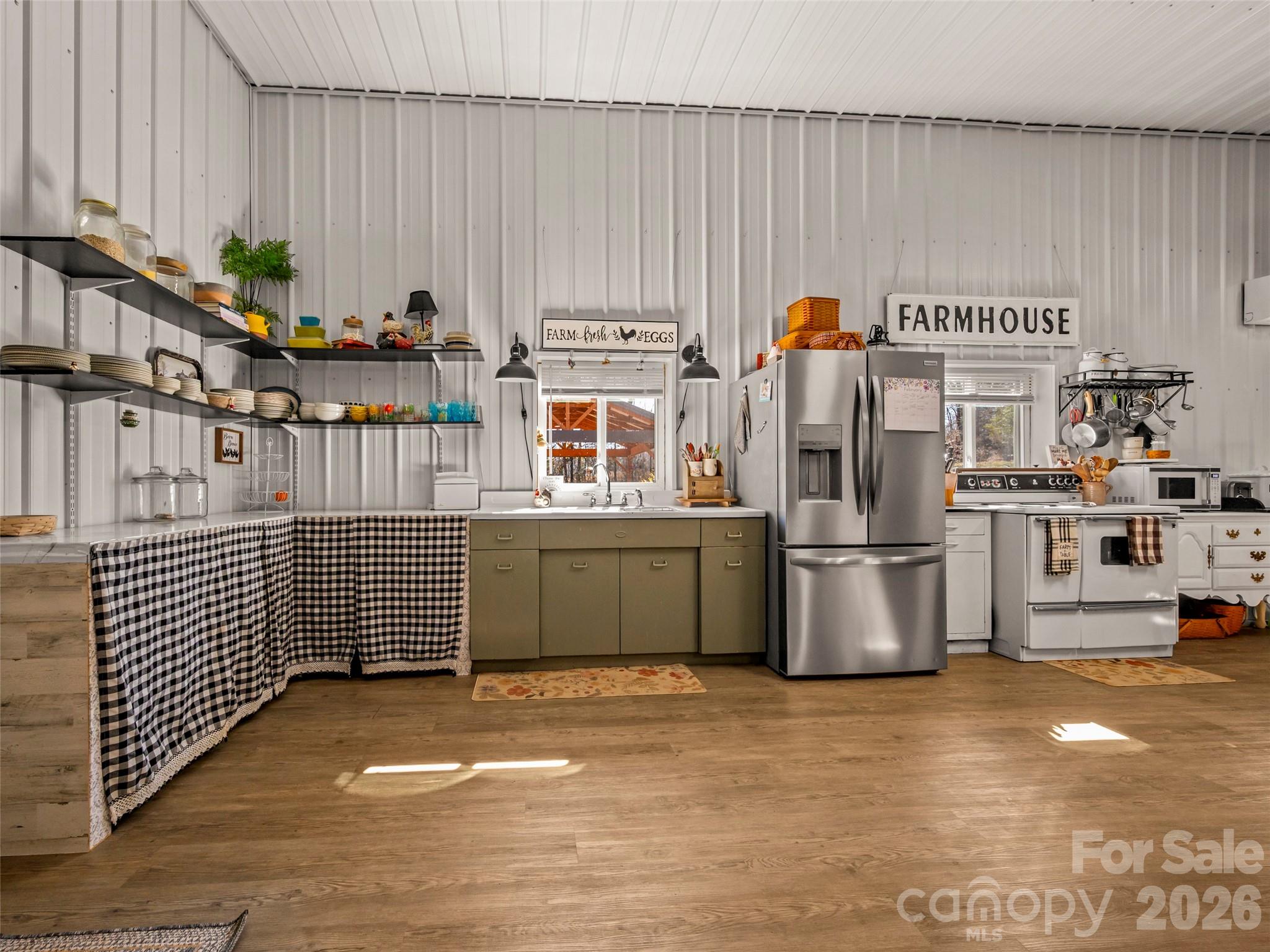 873 Ellenboro Henrietta Road Ellenboro, NC 28040 - Photo 10 of 48 a kitchen with stainless steel appliances a stove a refrigerator and a sink