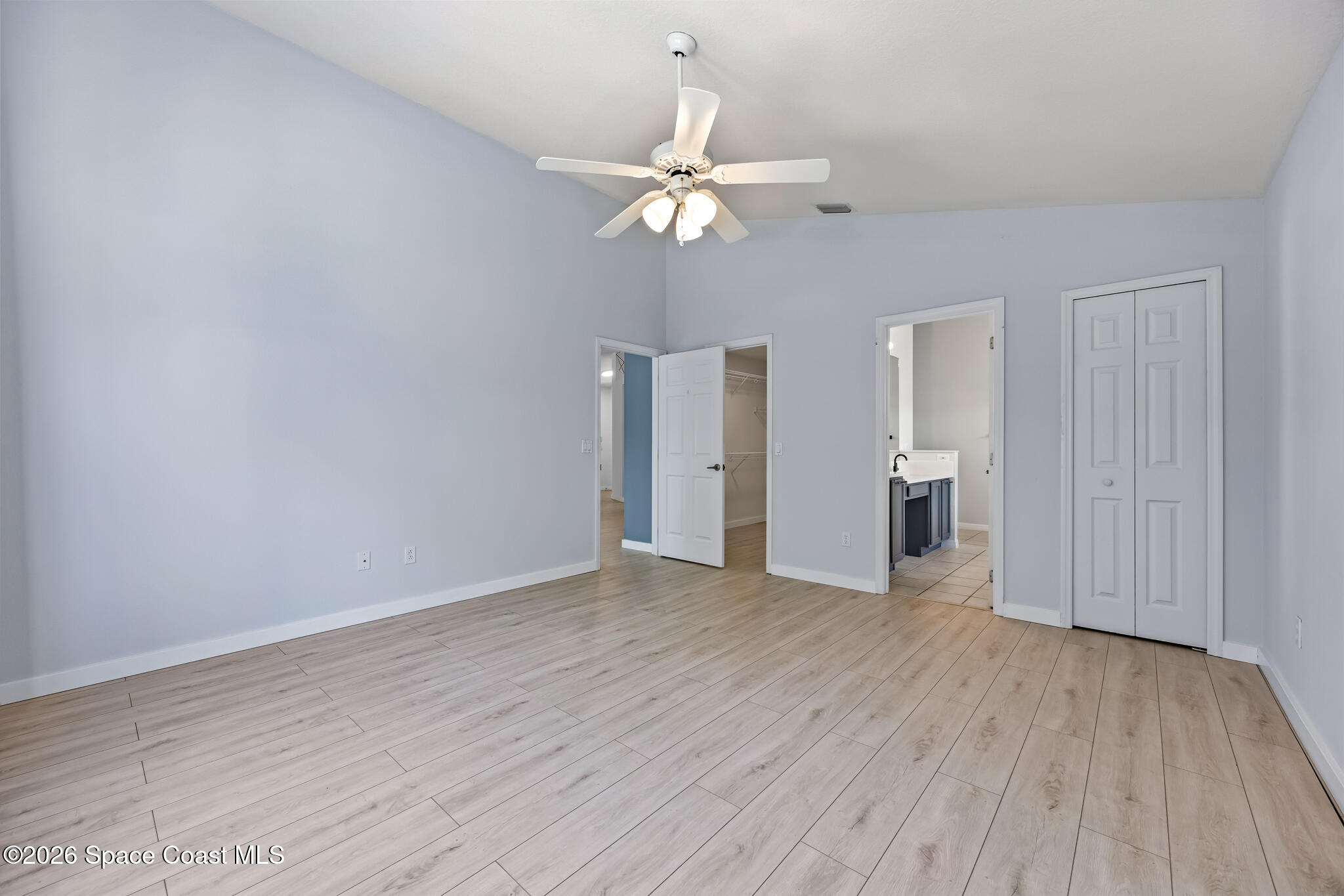 1915 Worchester Way Merritt Island, FL 32953 - Photo 11 of 27 wooden floor in an empty room with a window