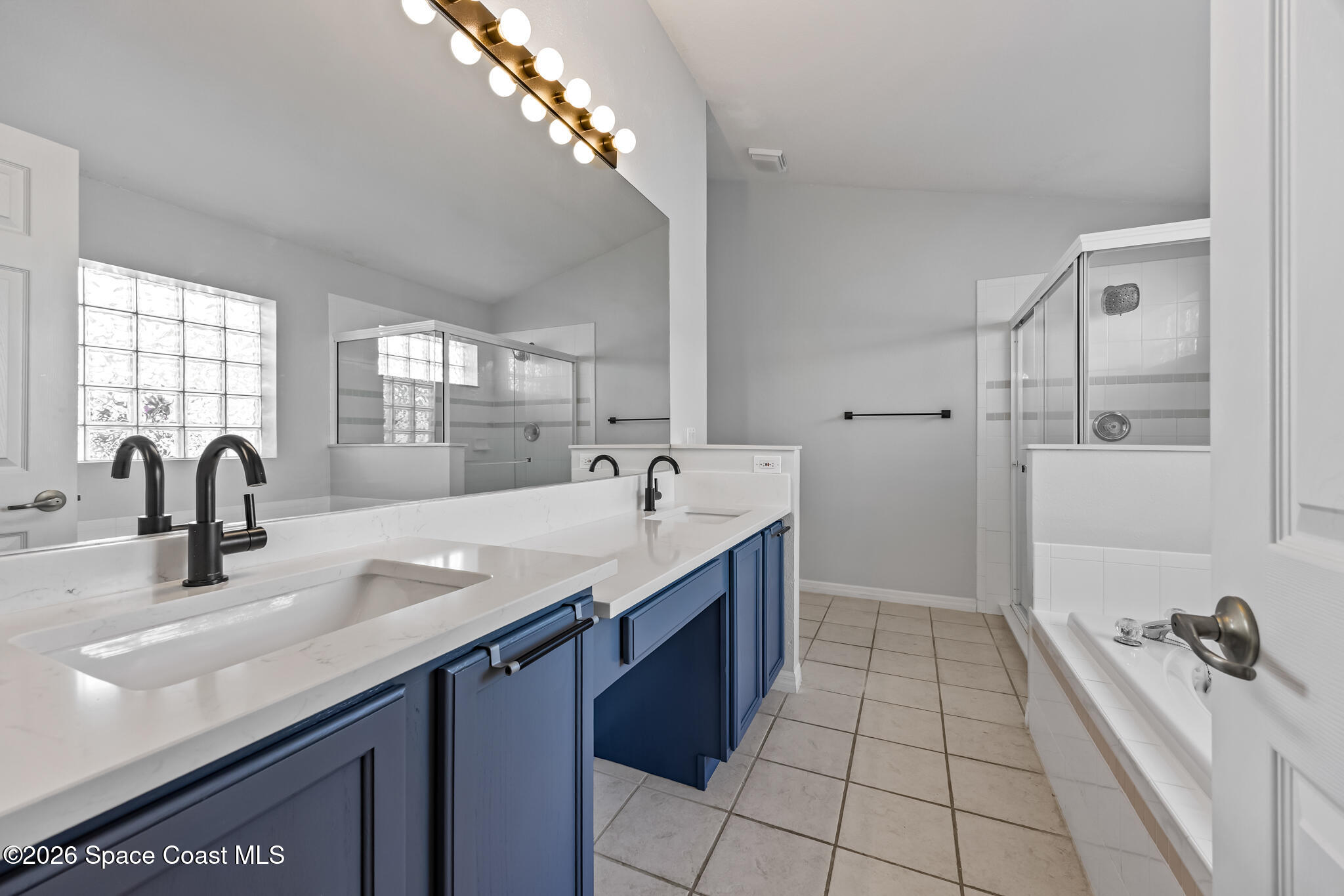 1915 Worchester Way Merritt Island, FL 32953 - Photo 12 of 27 a bathroom with a sink a double vanity and a mirror
