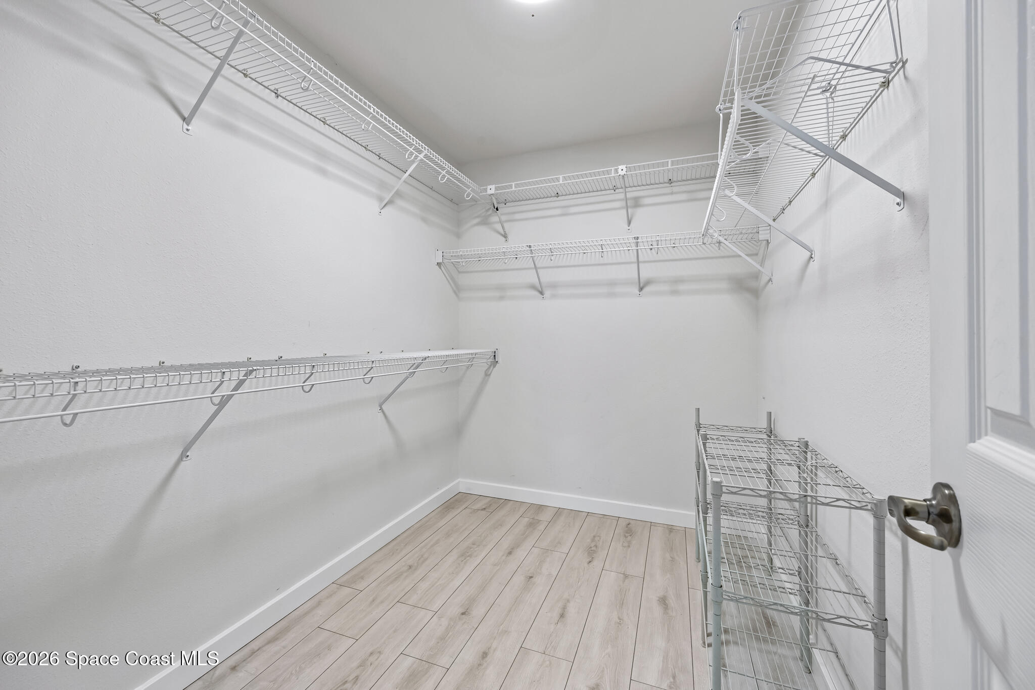 1915 Worchester Way Merritt Island, FL 32953 - Photo 14 of 27 a view of a room with racks on the wall