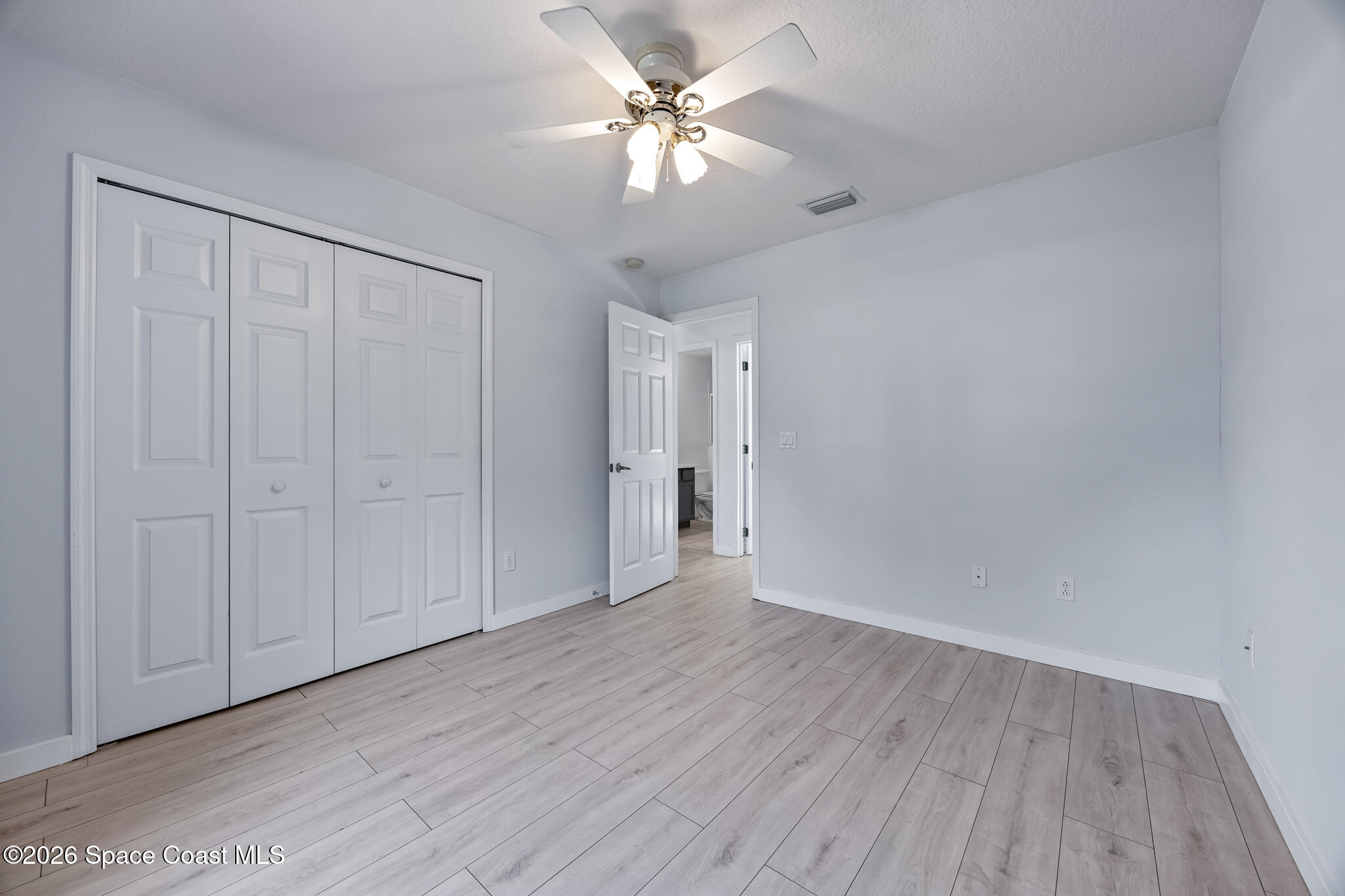 1915 Worchester Way Merritt Island, FL 32953 - Photo 16 of 27 a view of an empty room and wooden floor