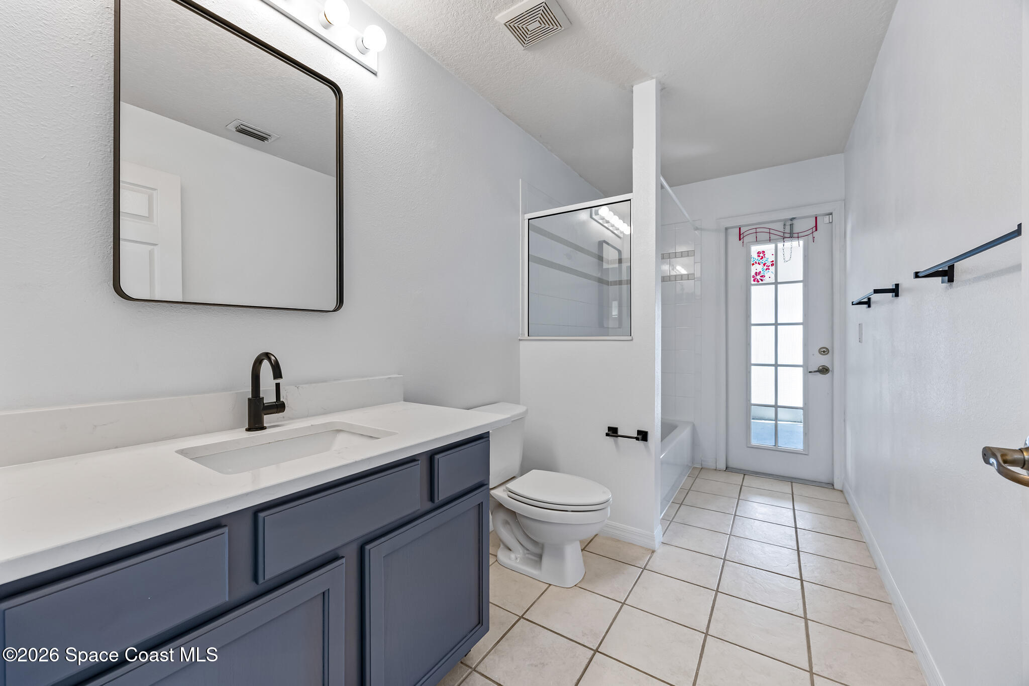 1915 Worchester Way Merritt Island, FL 32953 - Photo 17 of 27 a bathroom with a sink toilet and shower