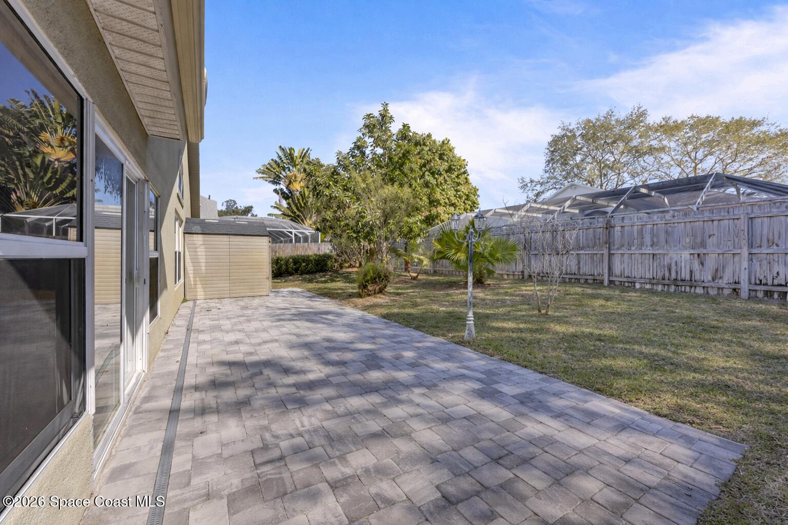 1915 Worchester Way Merritt Island, FL 32953 - Photo 23 of 27 a view of a backyard with pathway