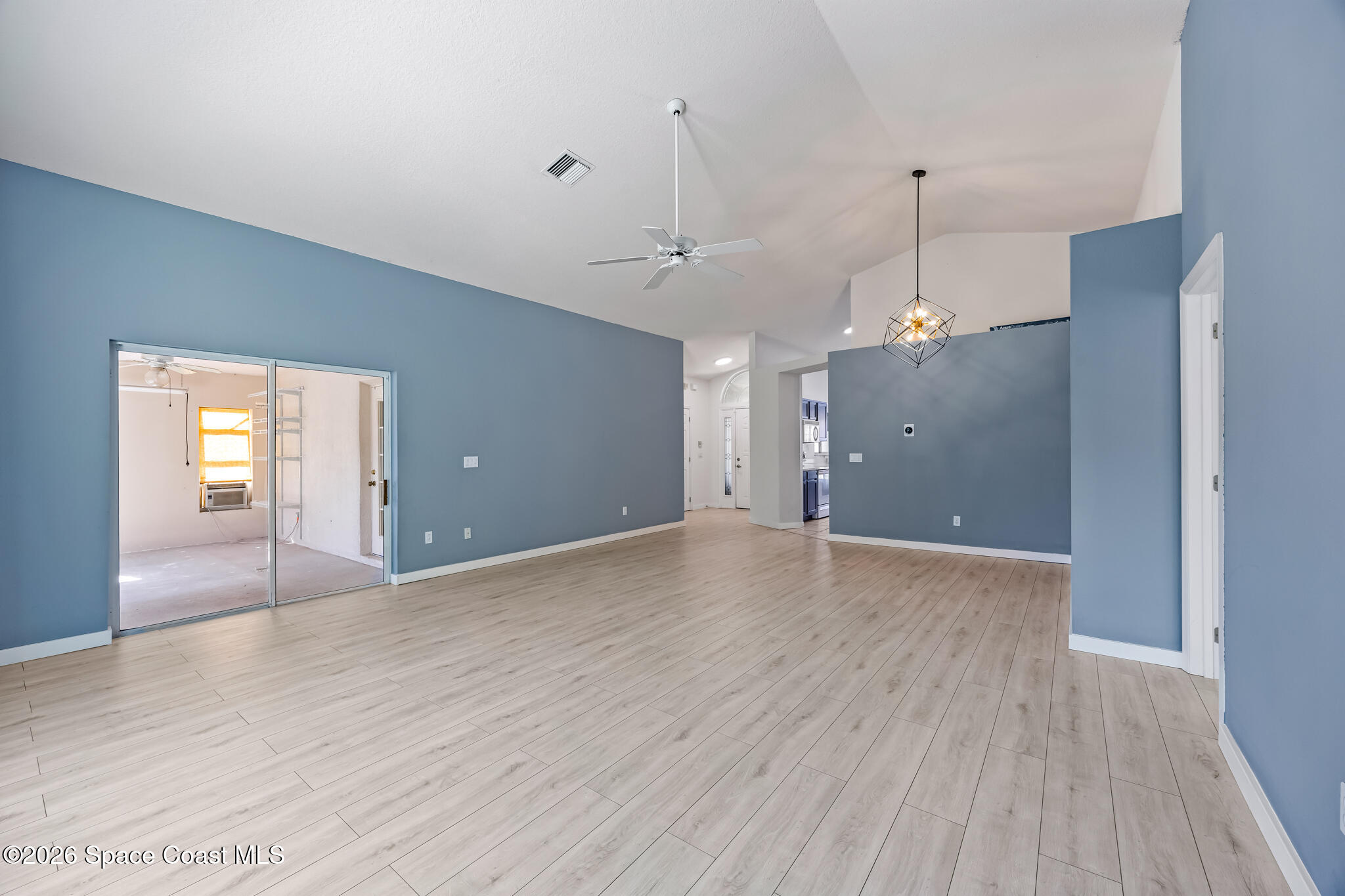 1915 Worchester Way Merritt Island, FL 32953 - Photo 5 of 27 a view of a big room with wooden floor and windows