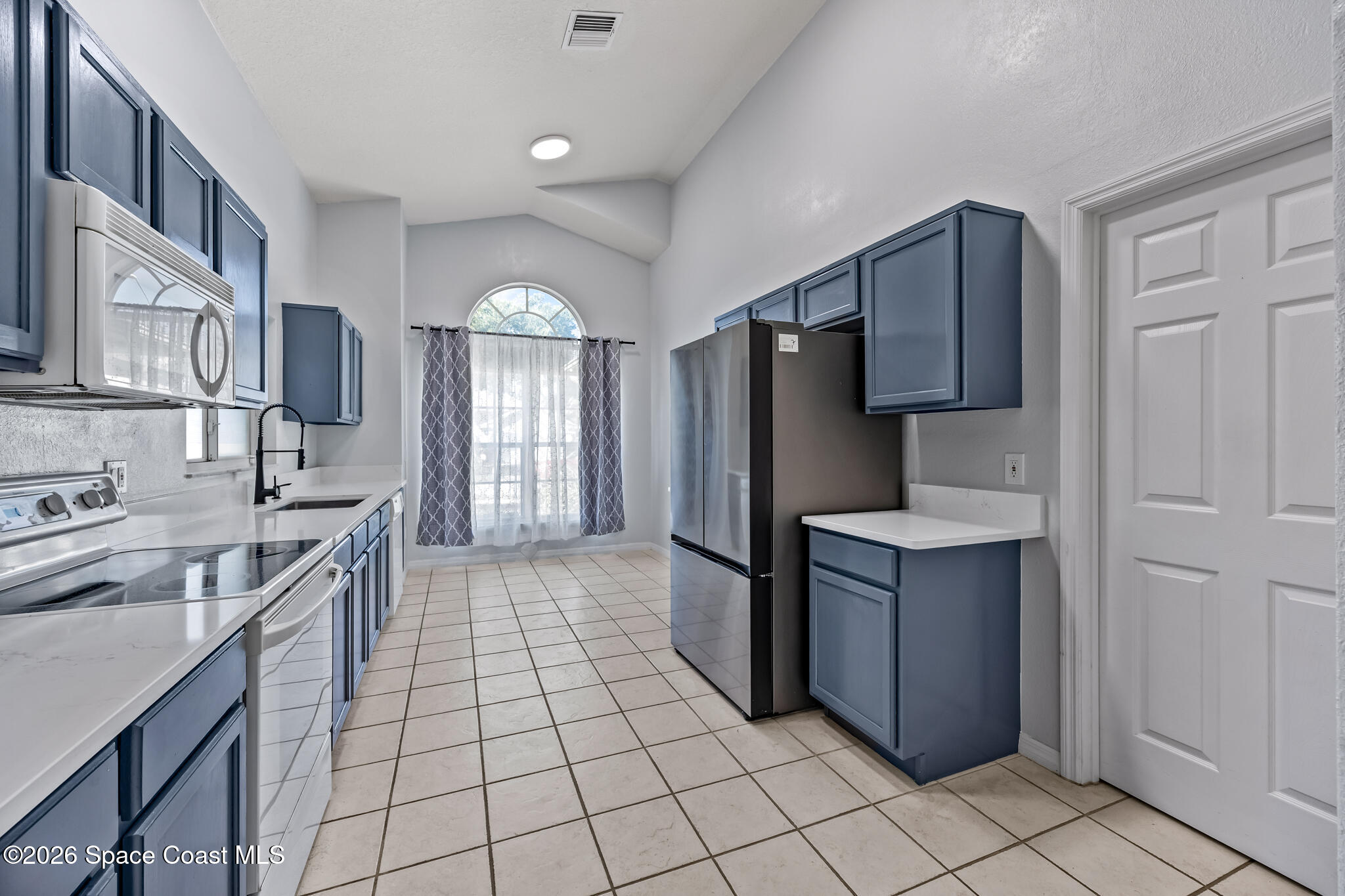 1915 Worchester Way Merritt Island, FL 32953 - Photo 6 of 27 a kitchen with stainless steel appliances granite countertop a refrigerator and a sink