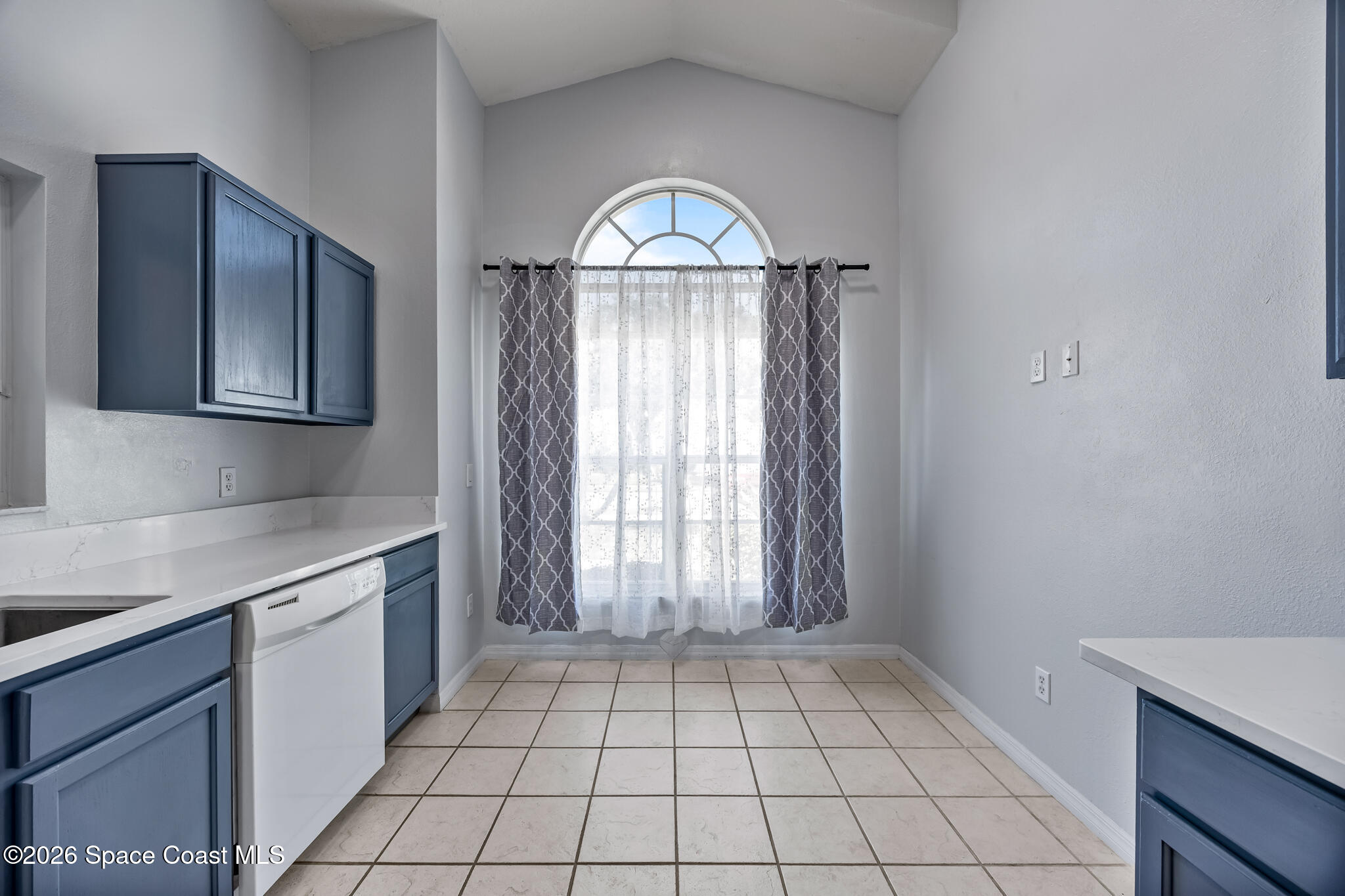 1915 Worchester Way Merritt Island, FL 32953 - Photo 7 of 27 a view of an empty kitchen with a sink and a window