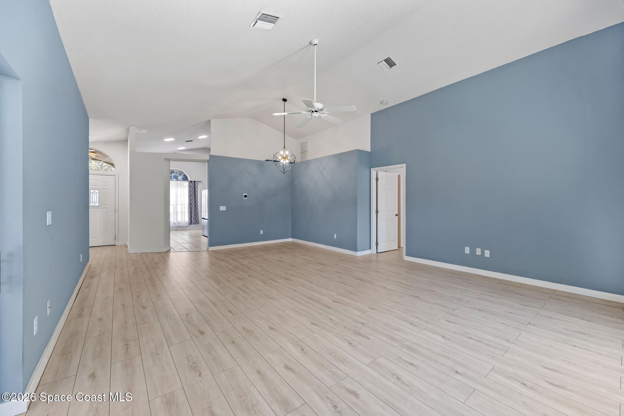 1915 Worchester Way Merritt Island, FL 32953 - Photo 9 of 27 a view of a big room with wooden floor and windows