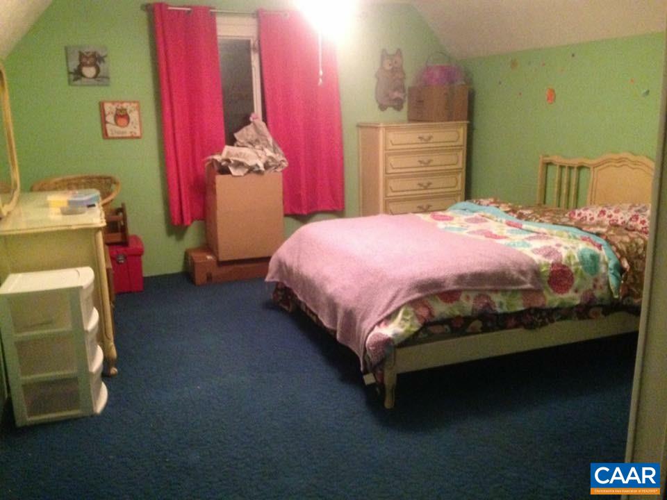 3148 Lyndhurst Road Stuarts Draft, VA 24477 - Photo 25 of 35 a bed sitting in a bedroom next to a window