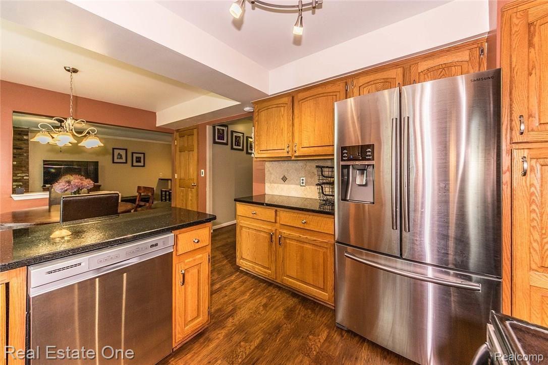 6127 Wedgewood Road Canton, MI 48187 - Photo 10 of 37 Nice cabinetry space w/pantry anchors the kitchen.