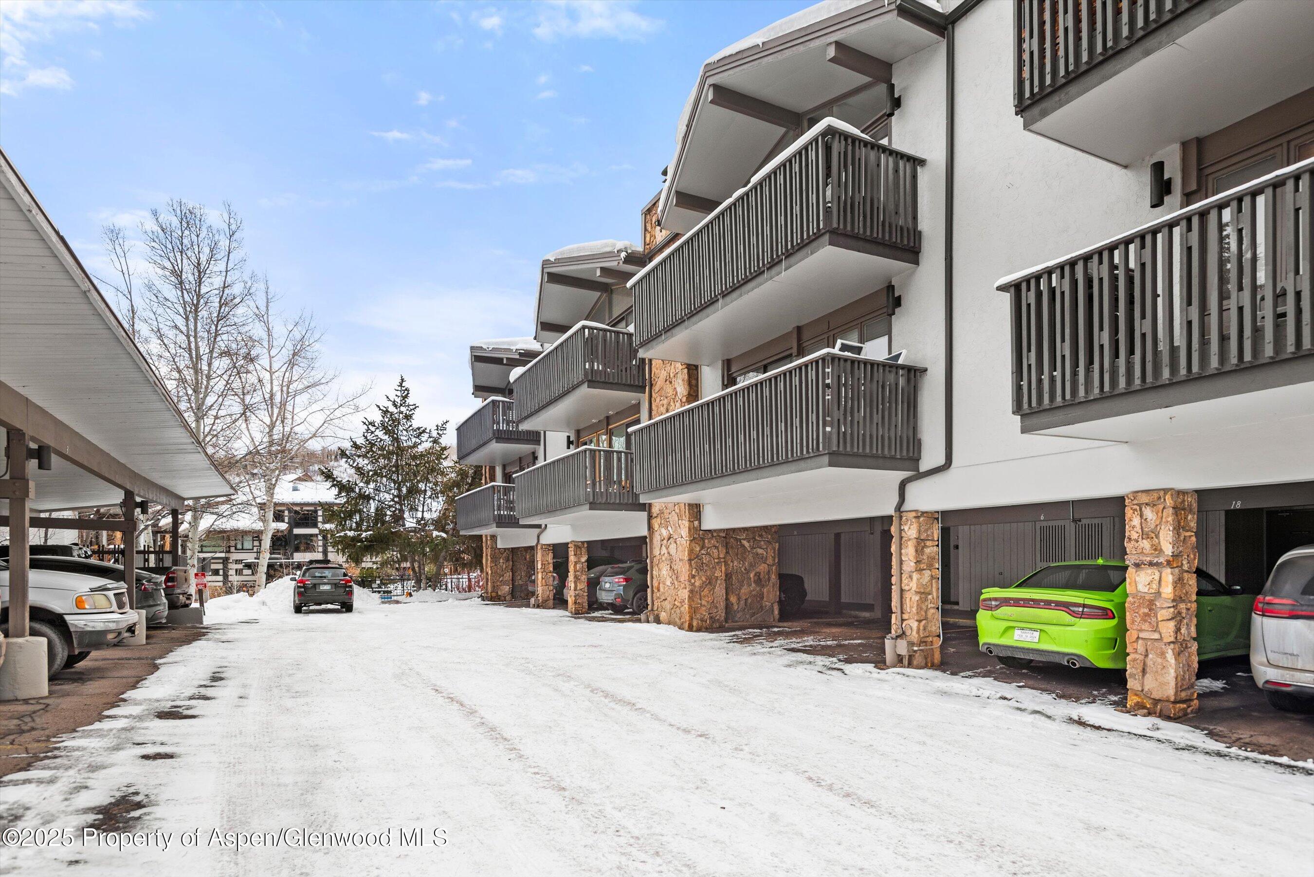 150 Carriage Way, Unit 3 Snowmass Village, CO 81615 - Photo 11 of 12 a view of a house with a park