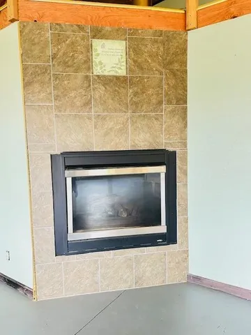 an empty room with windows and natural light