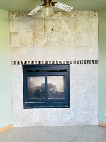 a view of a dry yard with mountains in the background