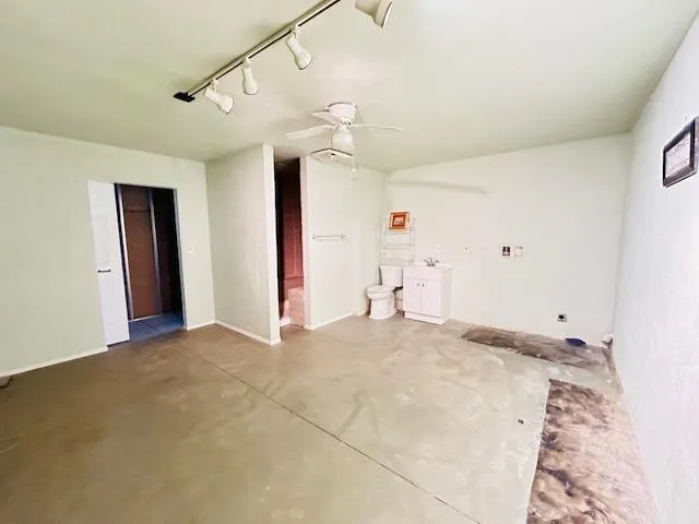 a view of a field with an ocean view