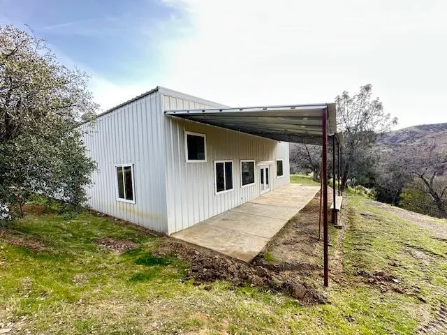 a view of a livingroom with an empty space and a stove
