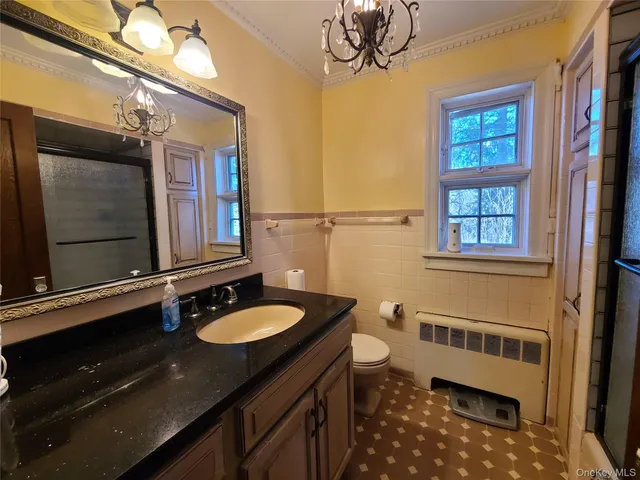 a bathroom with a sink a vanity and a mirror