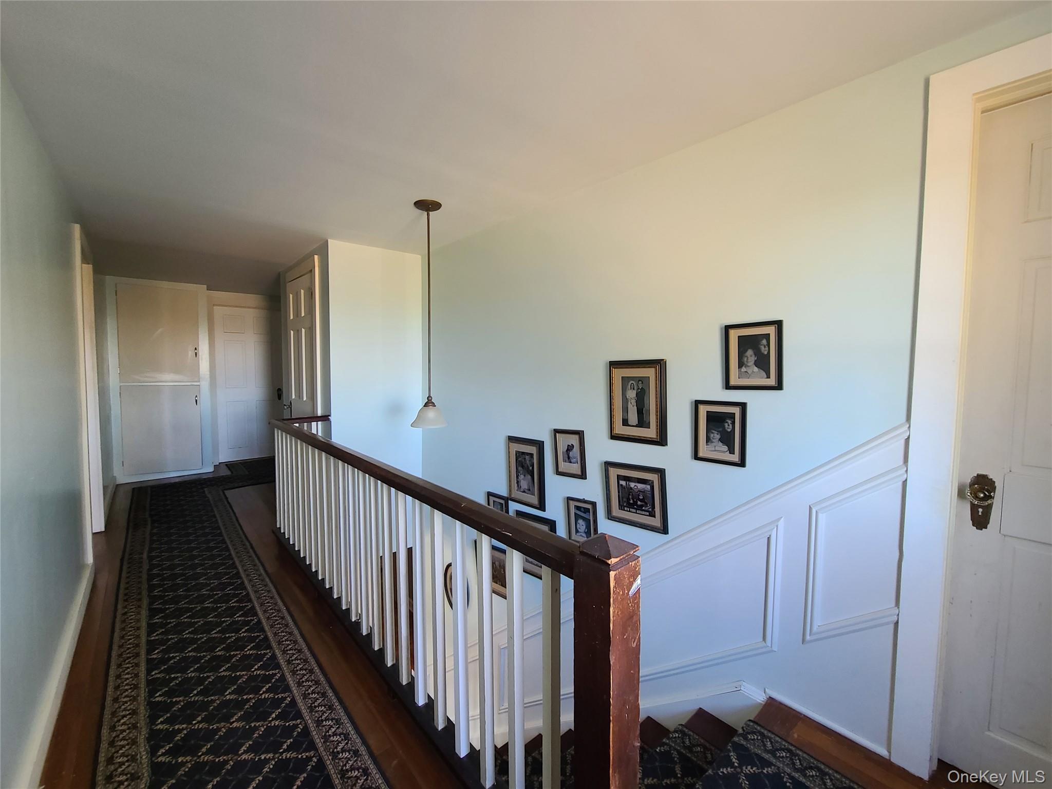 237 Best Road Swan Lake, NY 12783 - Photo 23 of 40 a view of a hallway with wooden floor and stairs