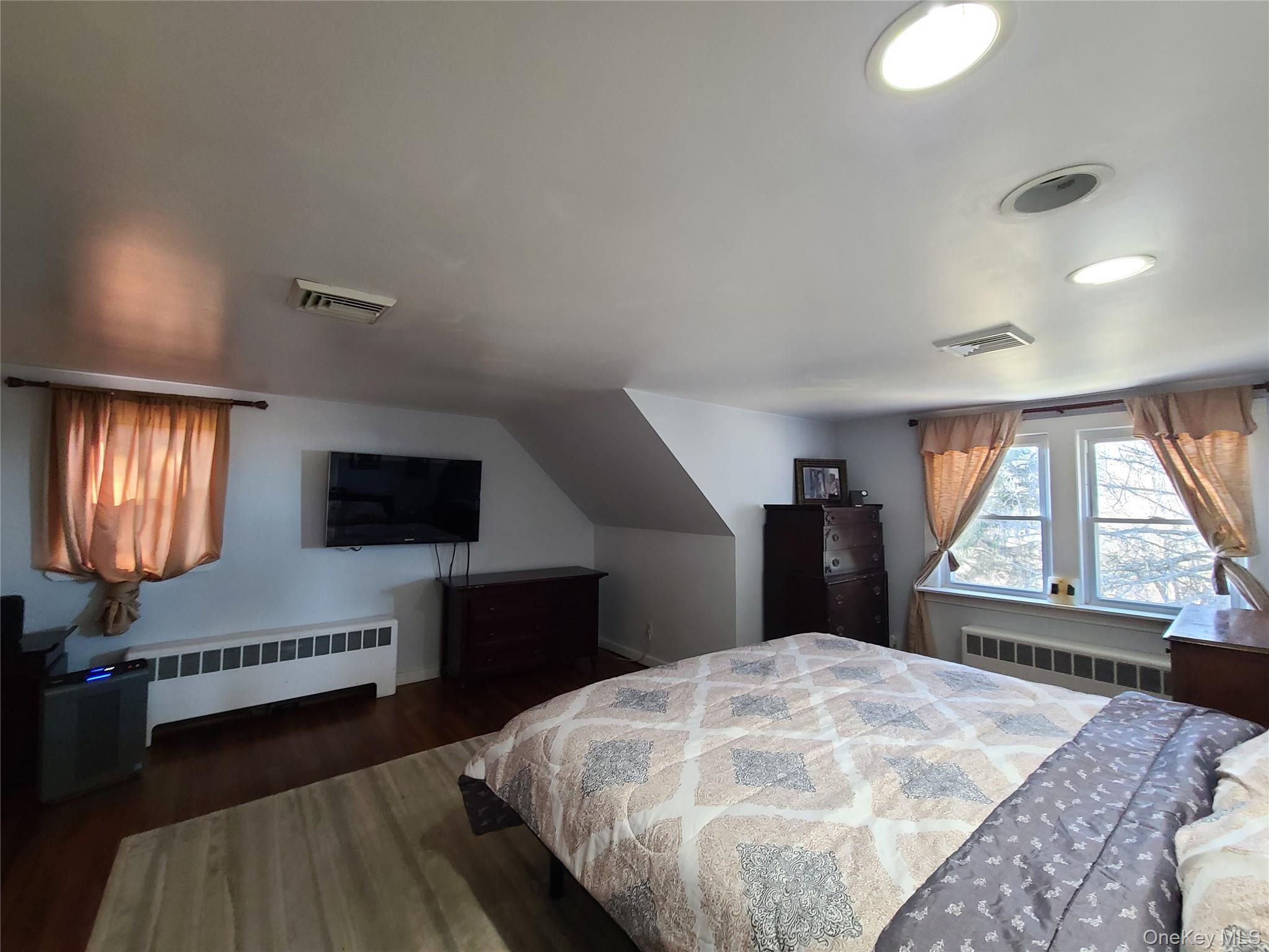 237 Best Road Swan Lake, NY 12783 - Photo 25 of 40 a bedroom with a bed and a flat screen tv