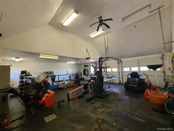 a view of a garage with a table and chairs