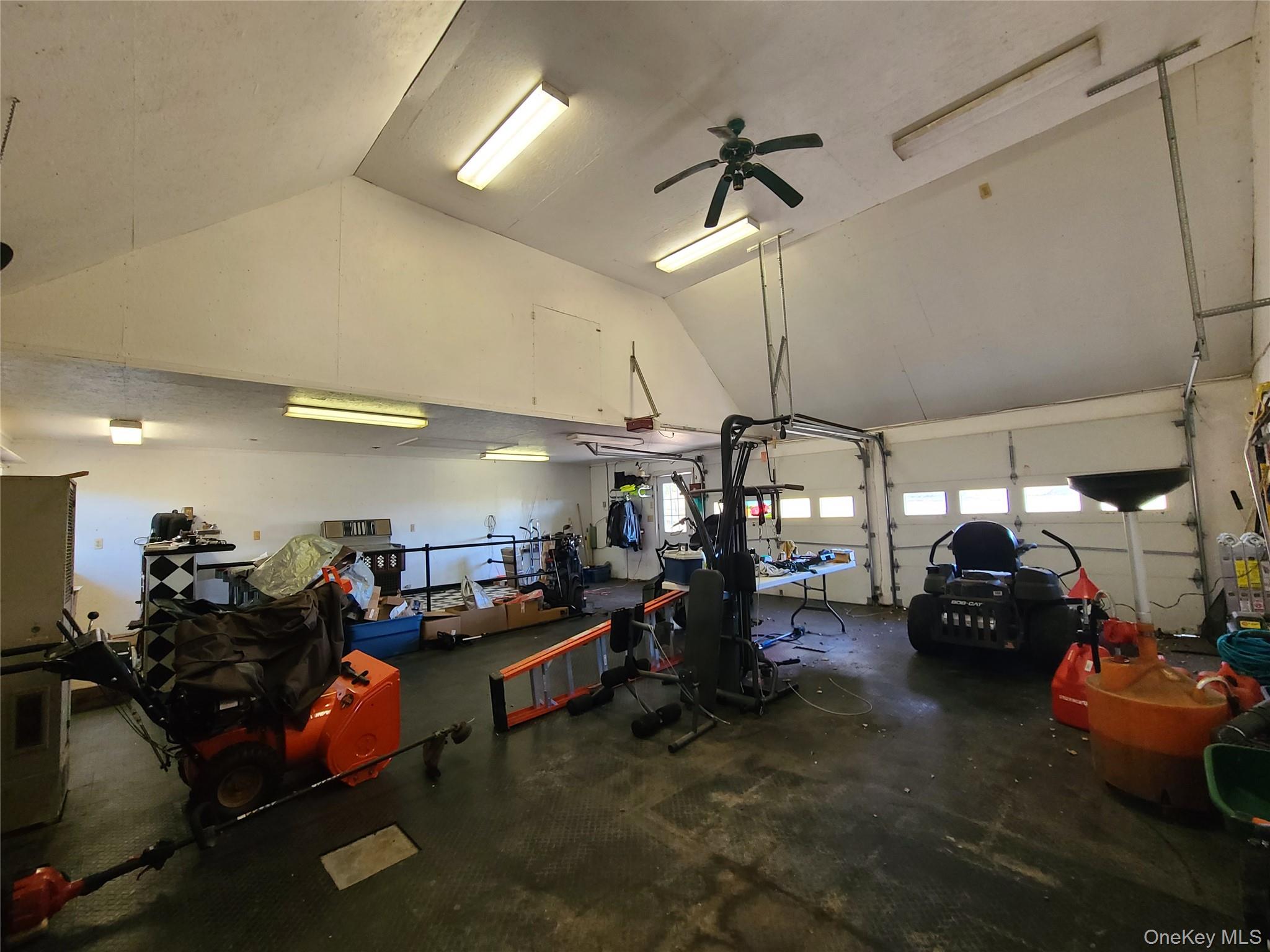 237 Best Road Swan Lake, NY 12783 - Photo 32 of 40 a view of a garage with a table and chairs