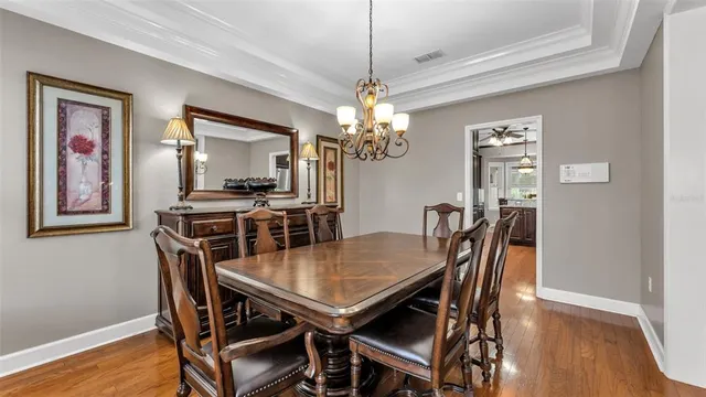 a bathroom with a sink a toilet a mirror and shower curtain