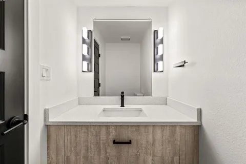 a sink with a mirror