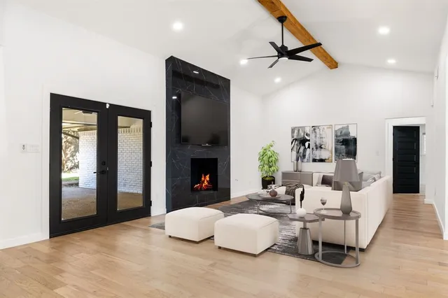 a living room with furniture and a fireplace