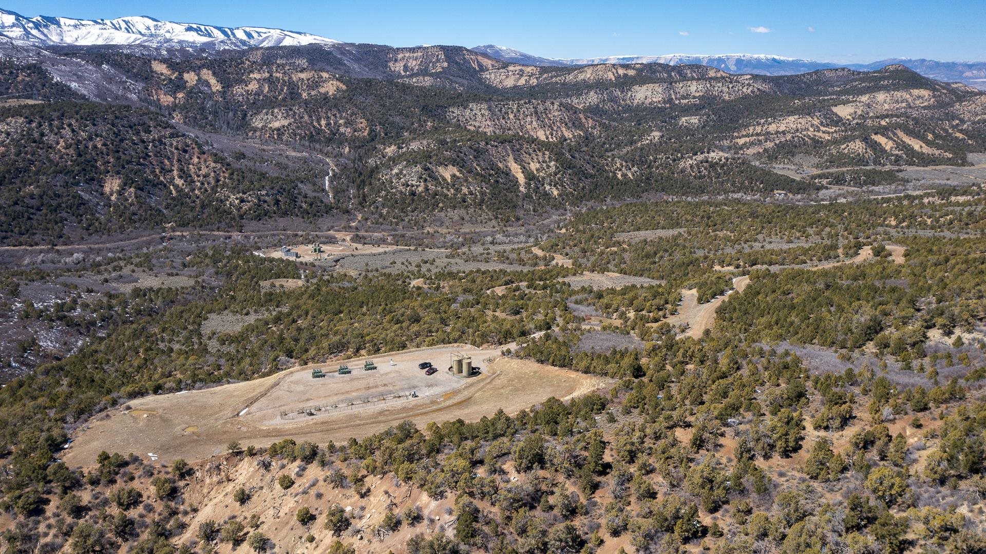 342 County Road 342 Collbran, CO 81624 - Photo 6 of 20 a view of a dry yard with mountains in the background