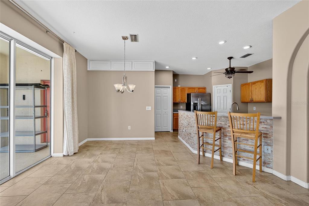 1615 Oracle Drive Ruskin, FL 33573 - Photo 21 of 87 a view of kitchen with furniture and refrigerator
