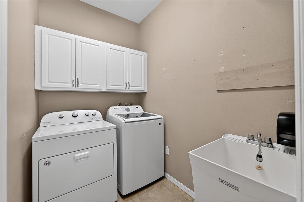 1615 Oracle Drive Ruskin, FL 33573 - Photo 33 of 87 a view of storage and utility room with washer and dryer