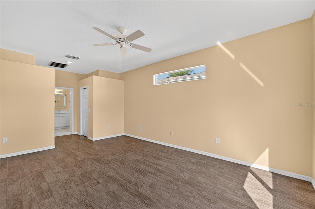 1615 Oracle Drive Ruskin, FL 33573 - Photo 37 of 87 a view of an empty room with wooden floor