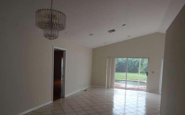 11217 Harbour Springs Circle Boca Raton, FL 33428 - Photo 11 of 12 a view of a room with a water heater and a window