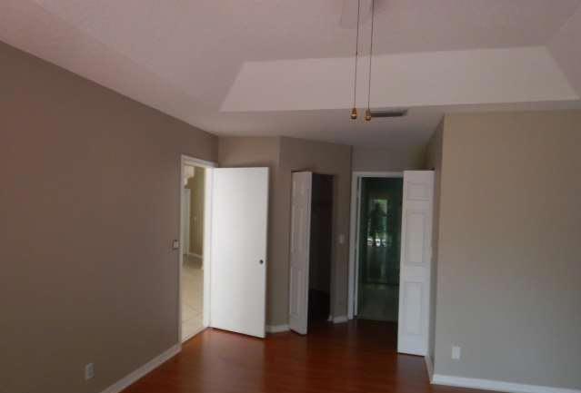 11217 Harbour Springs Circle Boca Raton, FL 33428 - Photo 10 of 12 a view of a hallway with wooden floor