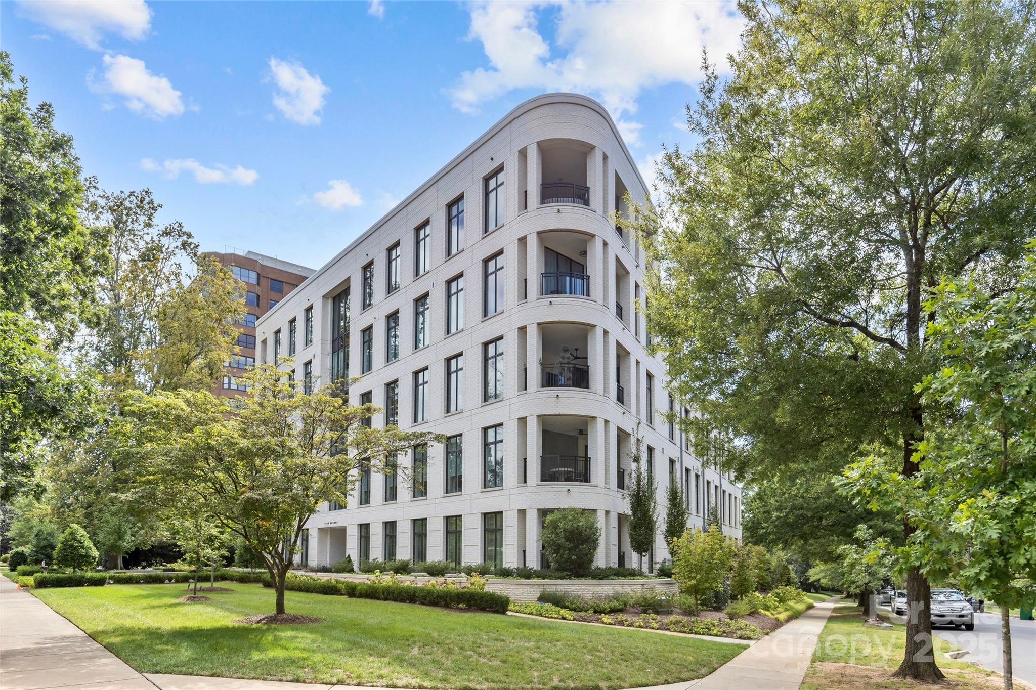 1500 Queens Road, Unit 104 Charlotte, NC 28207 - Photo 1 of 43 a view of building with yard