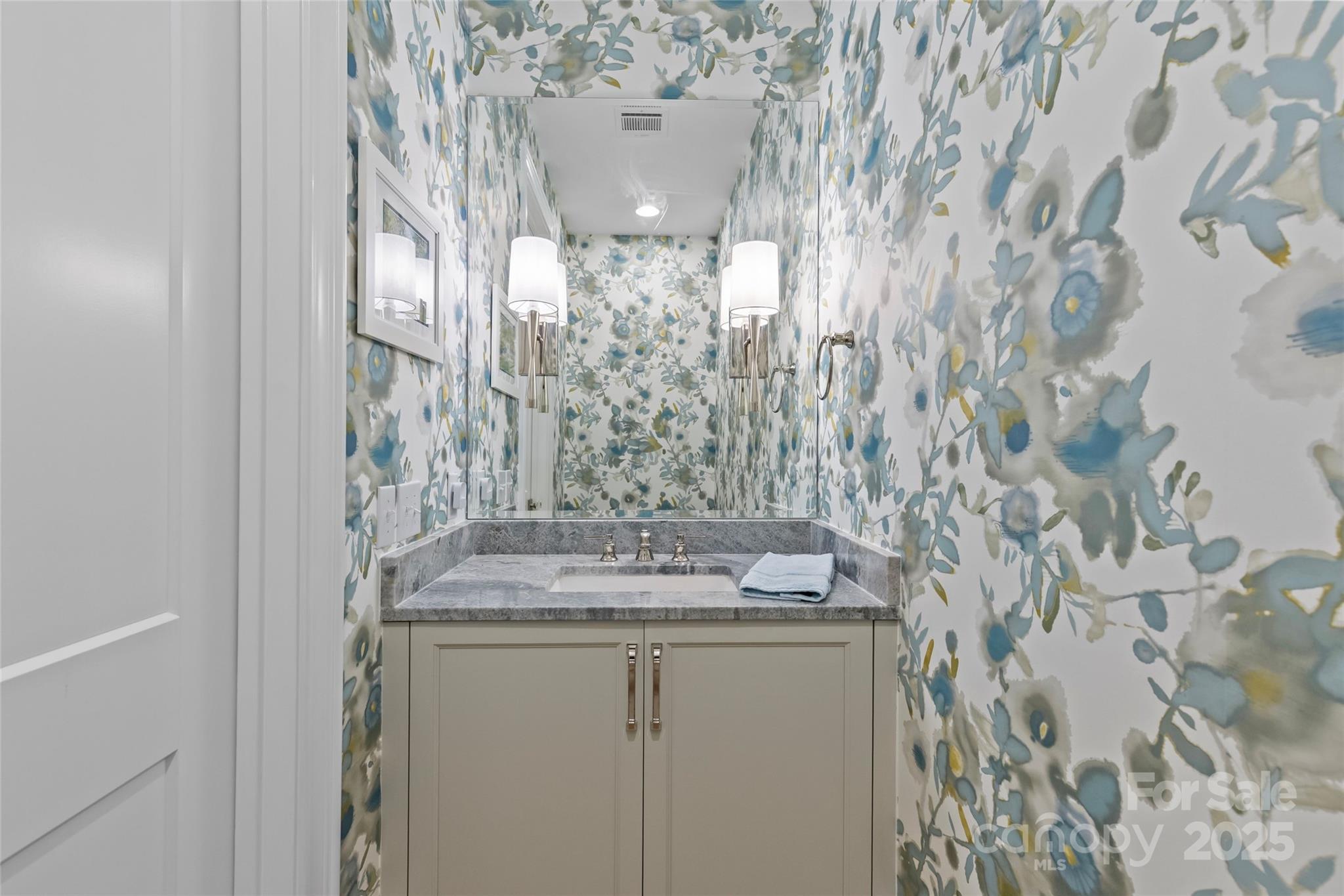 1500 Queens Road, Unit 104 Charlotte, NC 28207 - Photo 17 of 43 a bathroom with a granite countertop sink and a mirror