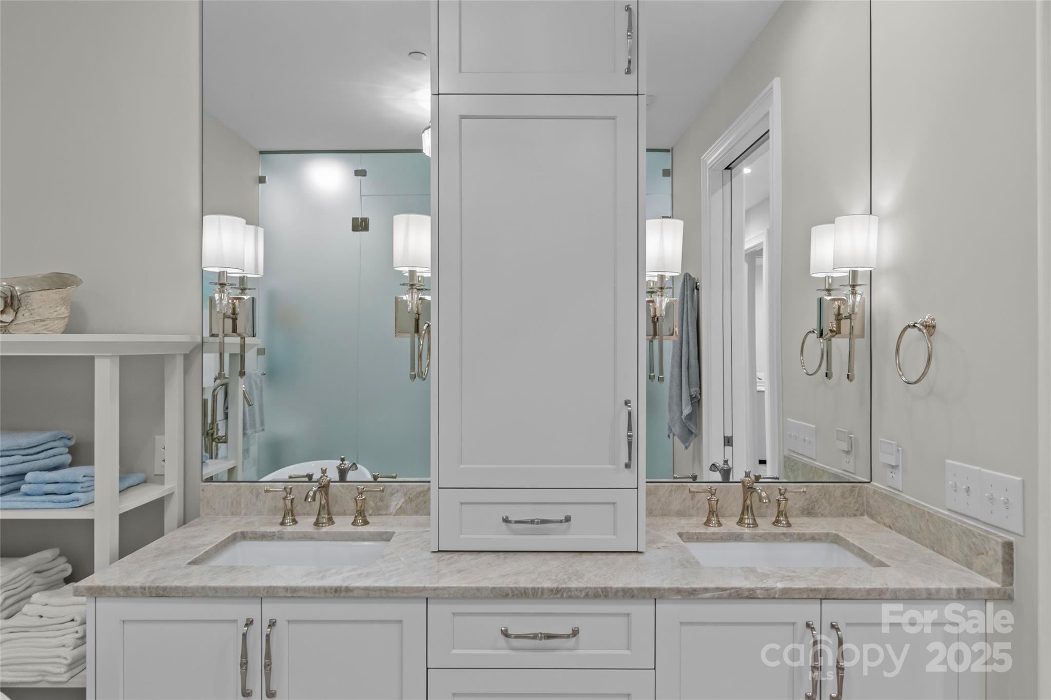 1500 Queens Road, Unit 104 Charlotte, NC 28207 - Photo 29 of 43 a bathroom with double vanity sinks and a mirror