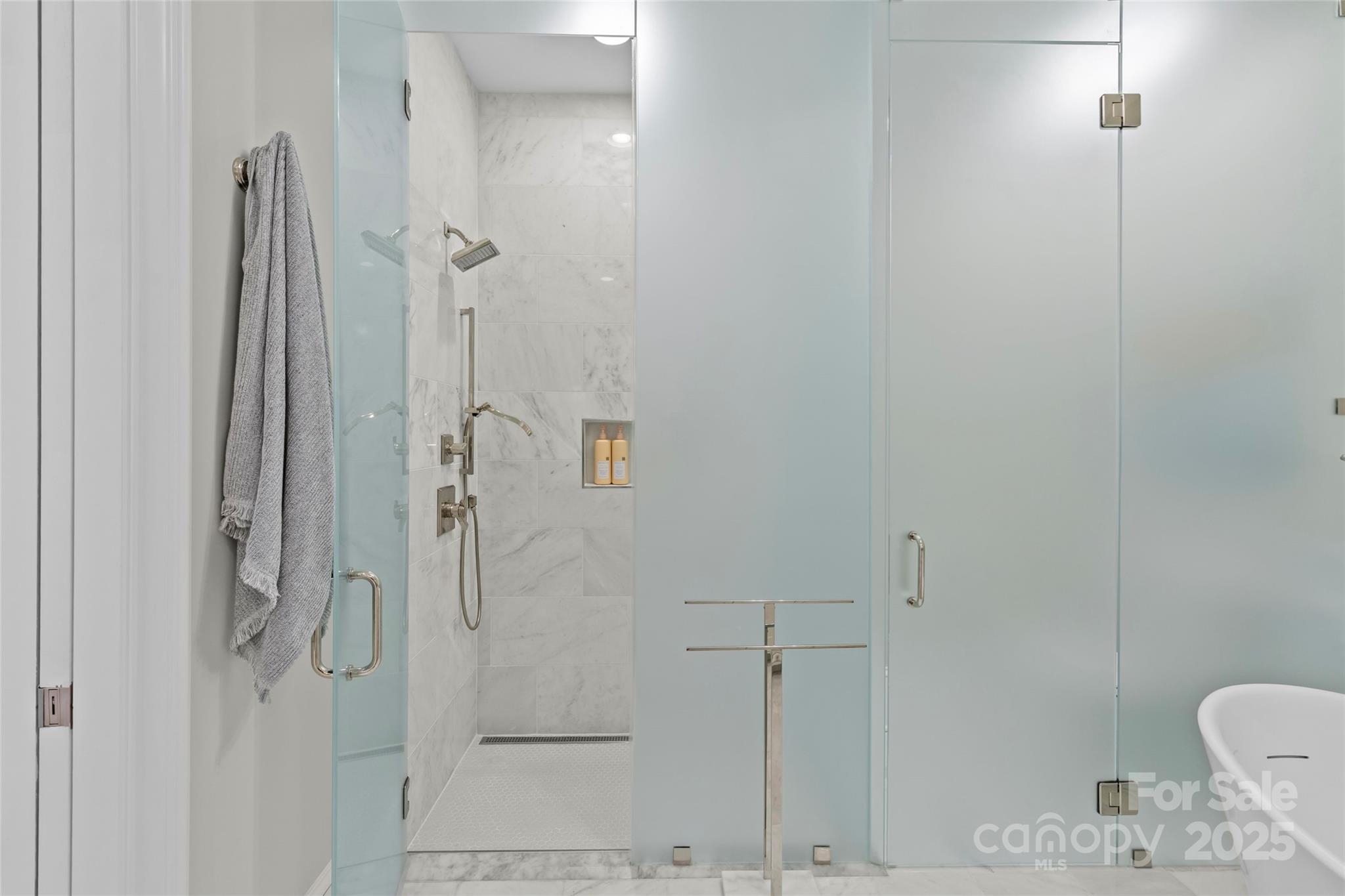 1500 Queens Road, Unit 104 Charlotte, NC 28207 - Photo 30 of 43 a bathroom with a shower