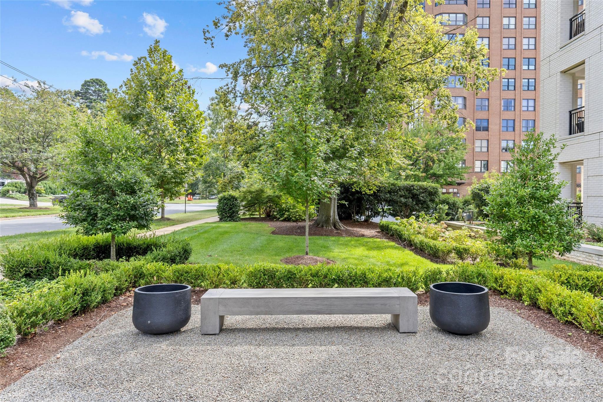 1500 Queens Road, Unit 104 Charlotte, NC 28207 - Photo 3 of 43 a view of a garden with potted plants