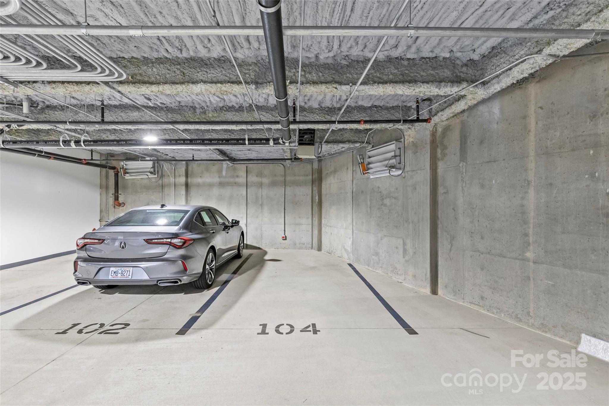 1500 Queens Road, Unit 104 Charlotte, NC 28207 - Photo 34 of 43 a car parked in a parking