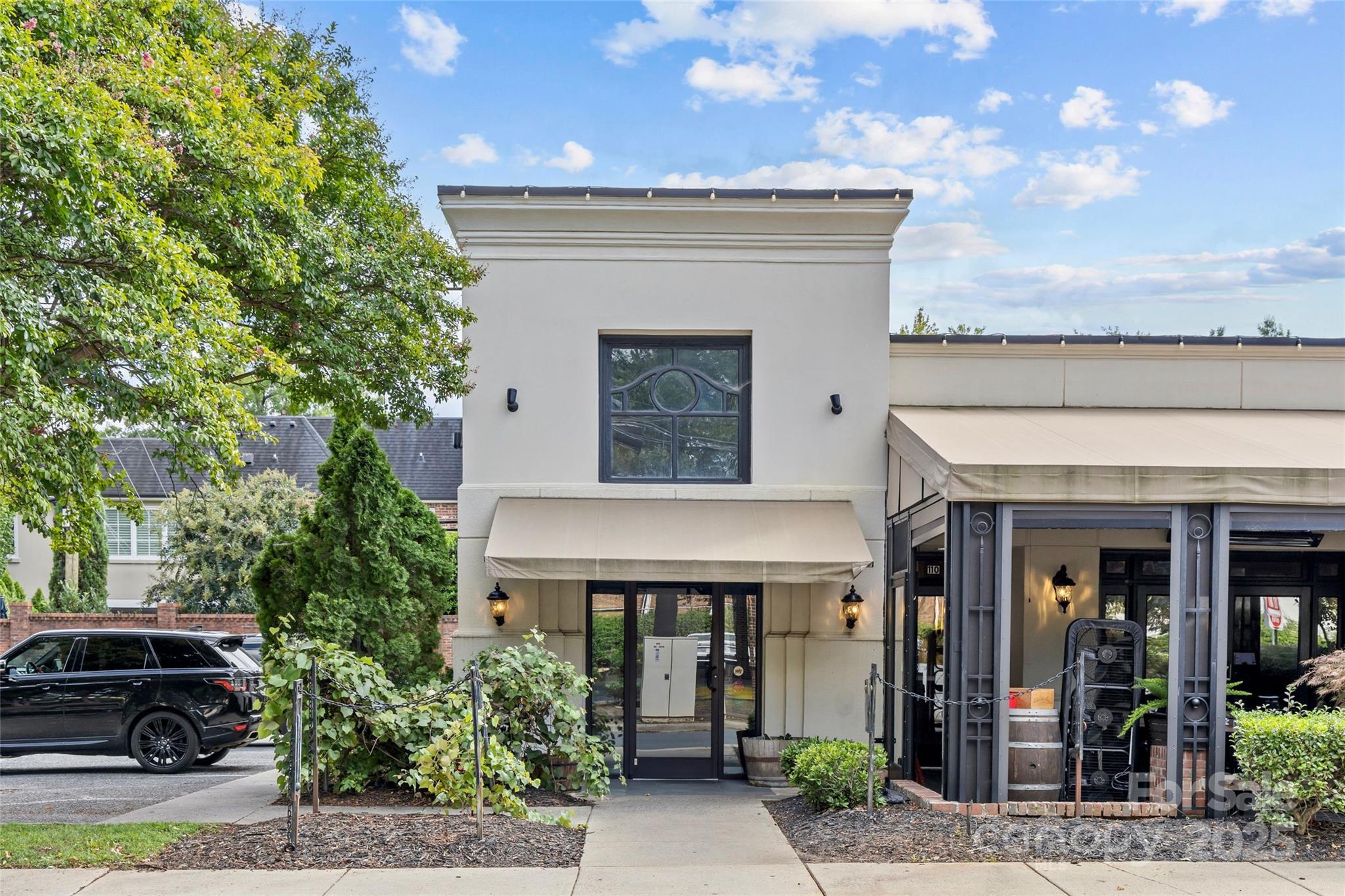 1500 Queens Road, Unit 104 Charlotte, NC 28207 - Photo 37 of 43 a view of a house with potted plants