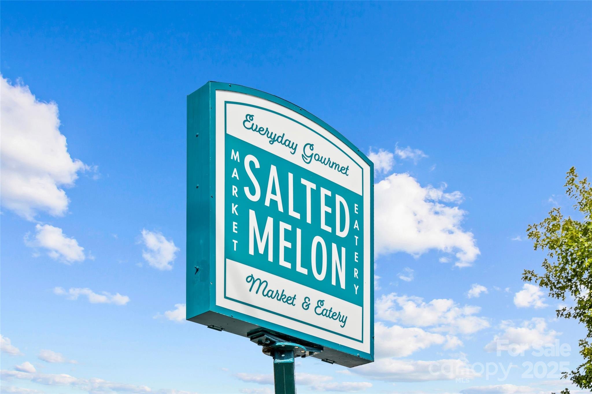 1500 Queens Road, Unit 104 Charlotte, NC 28207 - Photo 38 of 43 a sign on the side of a building