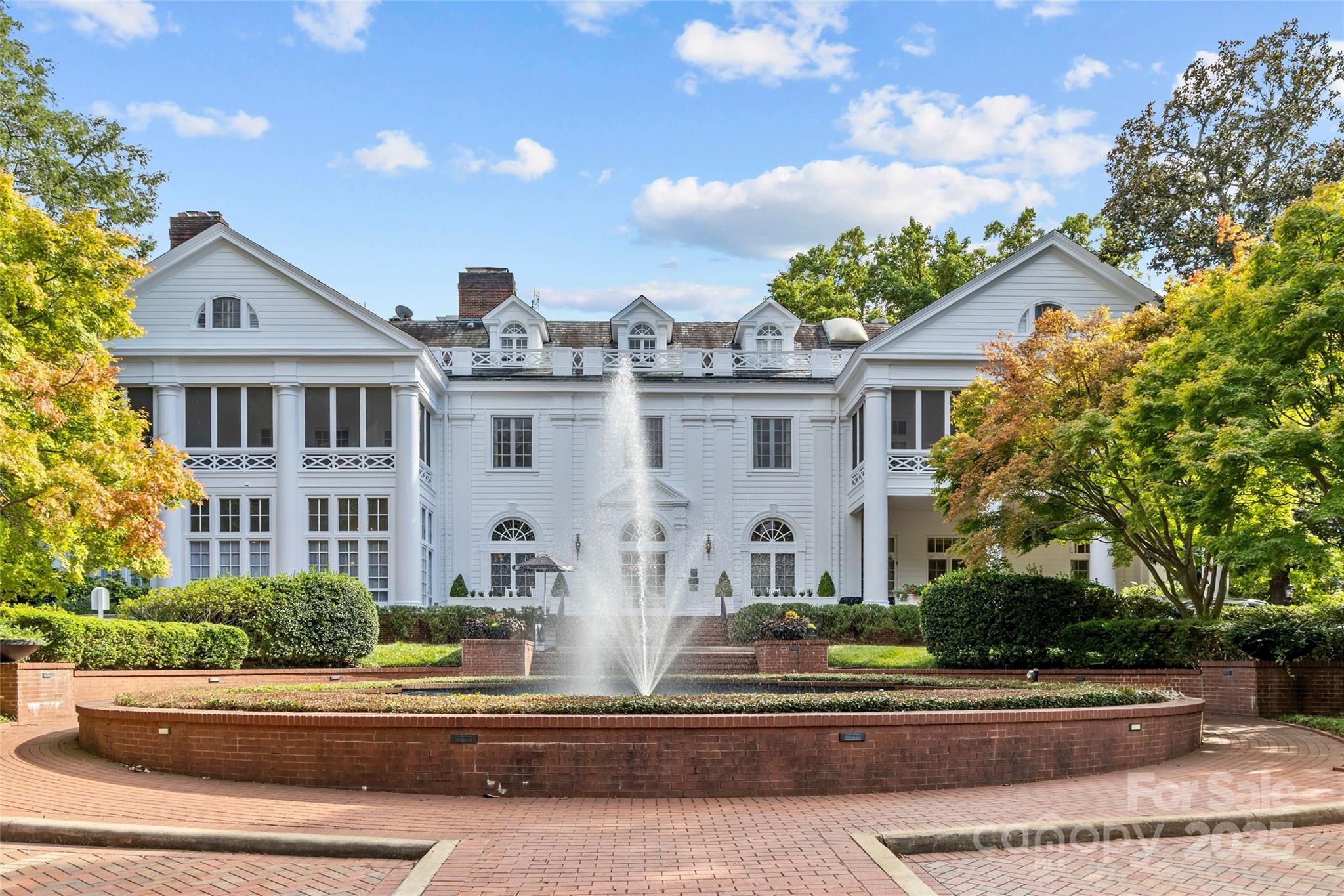 1500 Queens Road, Unit 104 Charlotte, NC 28207 - Photo 43 of 43 a front view of a house with a garden