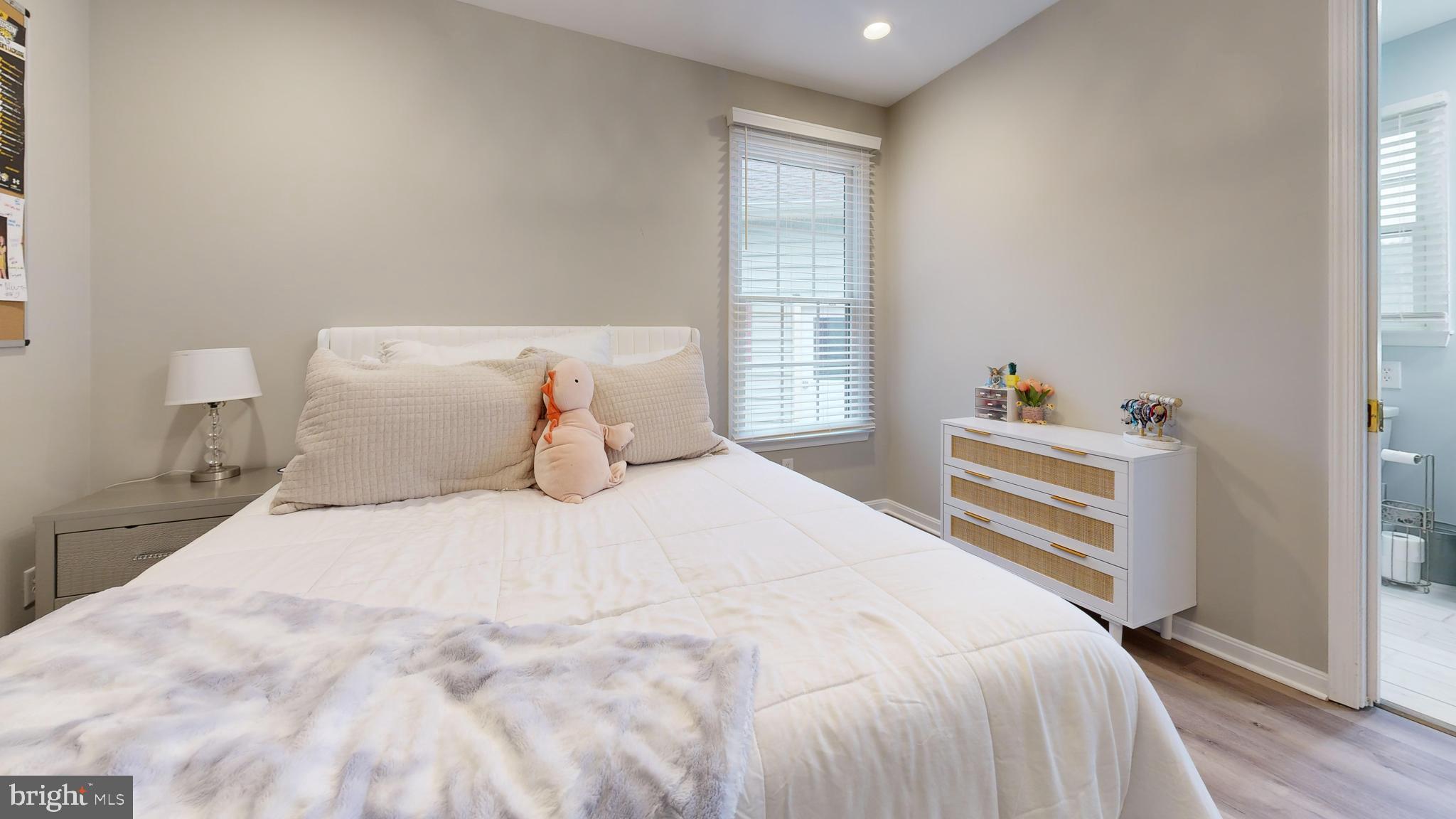 28715 Jacks Field Road Wye Mills, MD 21679 - Photo 17 of 27 a bedroom with a bed and wooden floor