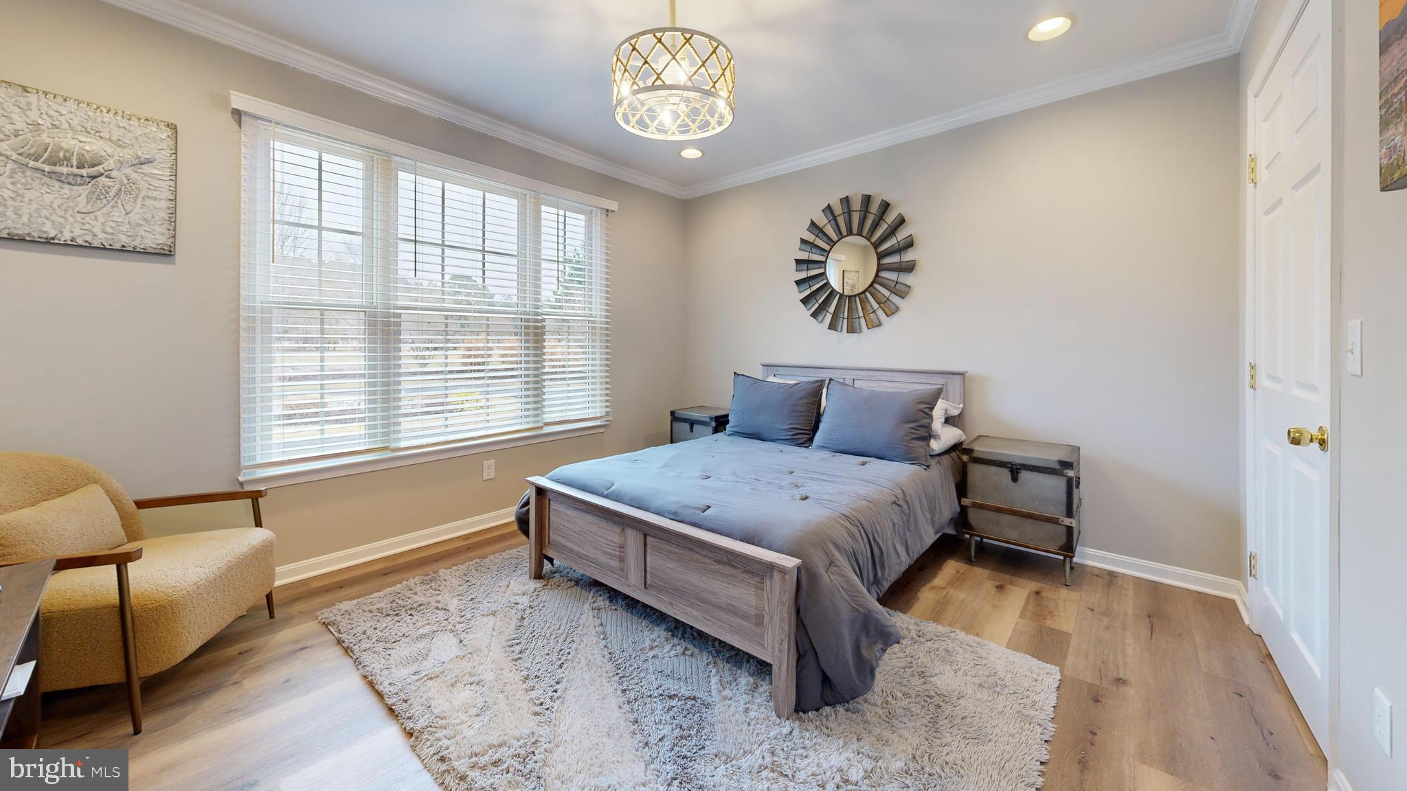28715 Jacks Field Road Wye Mills, MD 21679 - Photo 18 of 27 a bedroom with a bed and a window