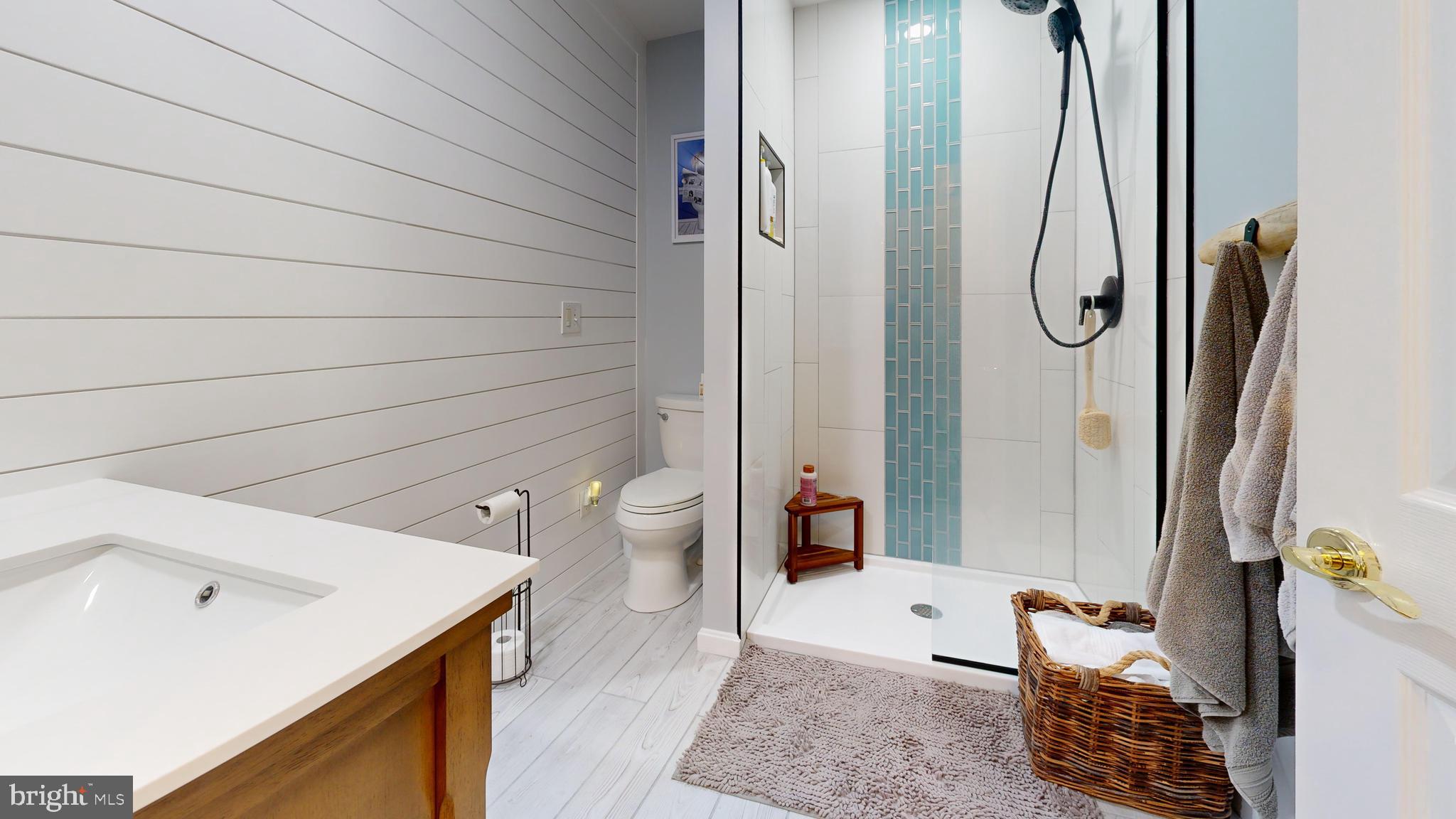 28715 Jacks Field Road Wye Mills, MD 21679 - Photo 19 of 27 a spacious bathroom with a granite countertop sink and a mirror