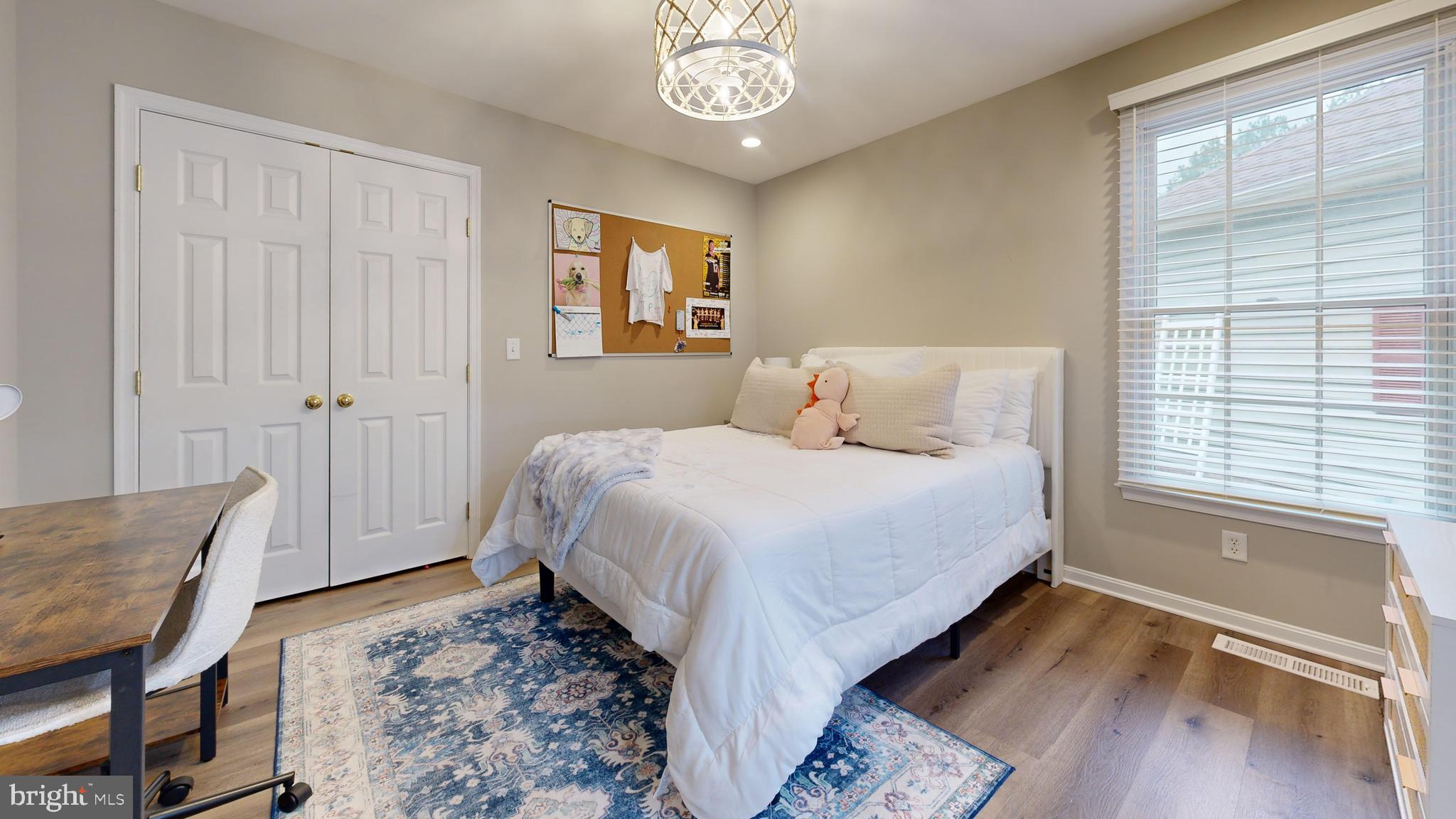 28715 Jacks Field Road Wye Mills, MD 21679 - Photo 22 of 27 a bedroom with a bed and a window